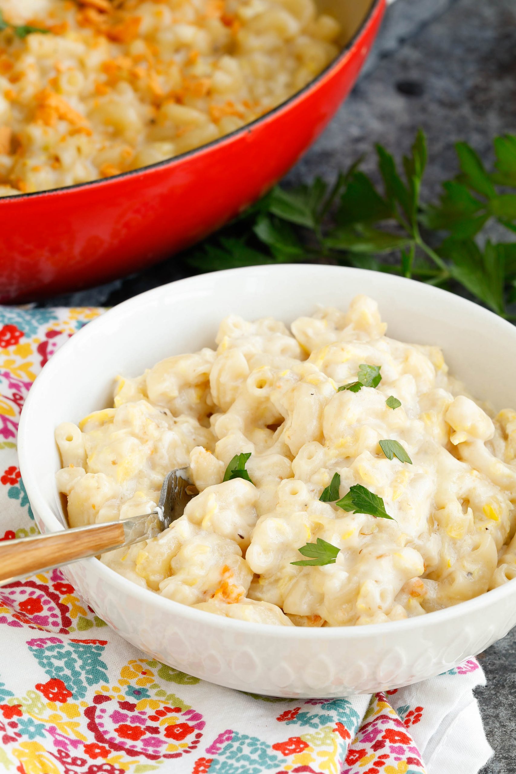 Summer Squash and Zucchini Mac and Cheese in a large bowl with a spoon.