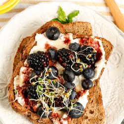 Black and Blueberry Ricotta Toast on plate