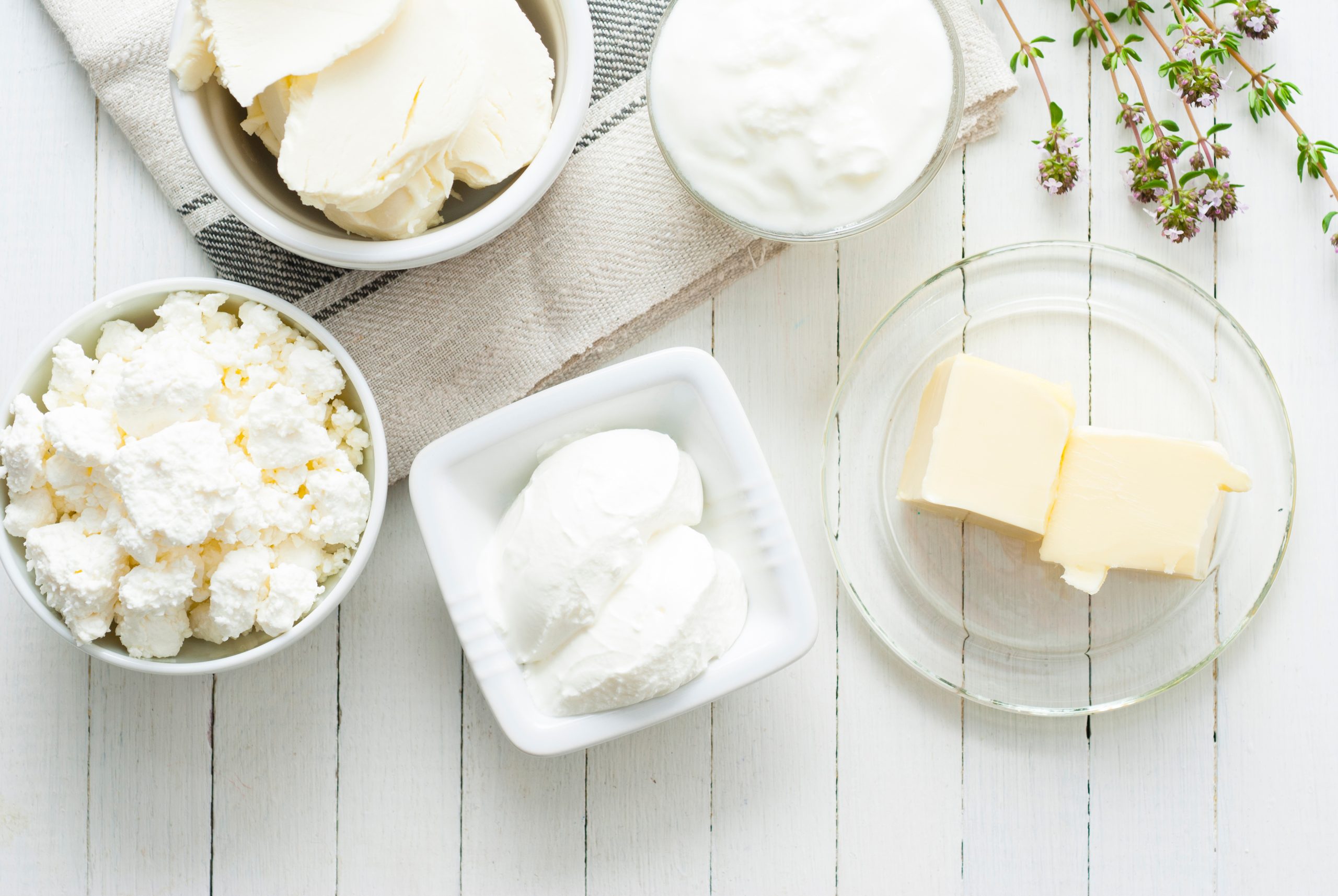 dairy products in bowls on a table.