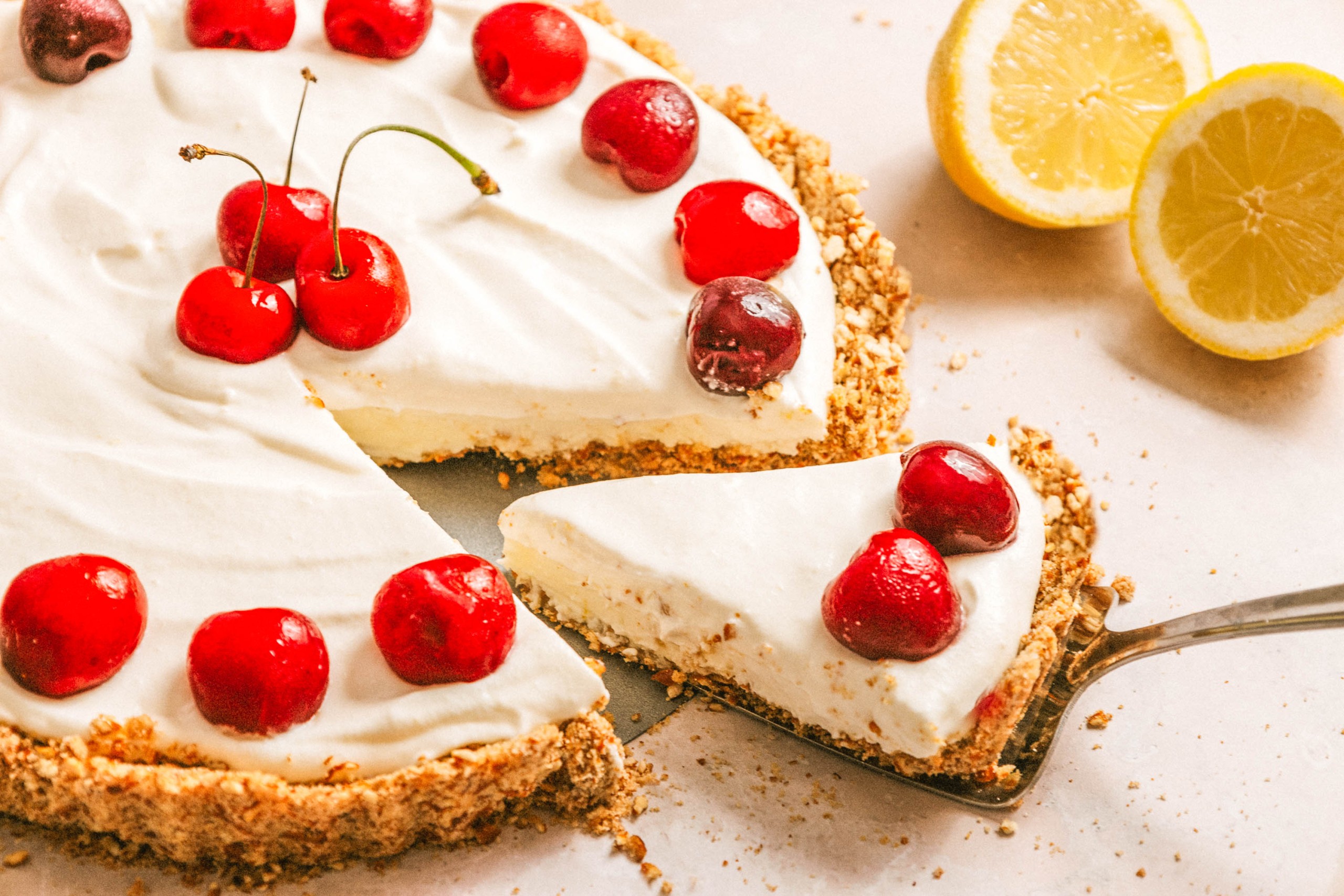 Slice of marcarpone tart on serving utensil.