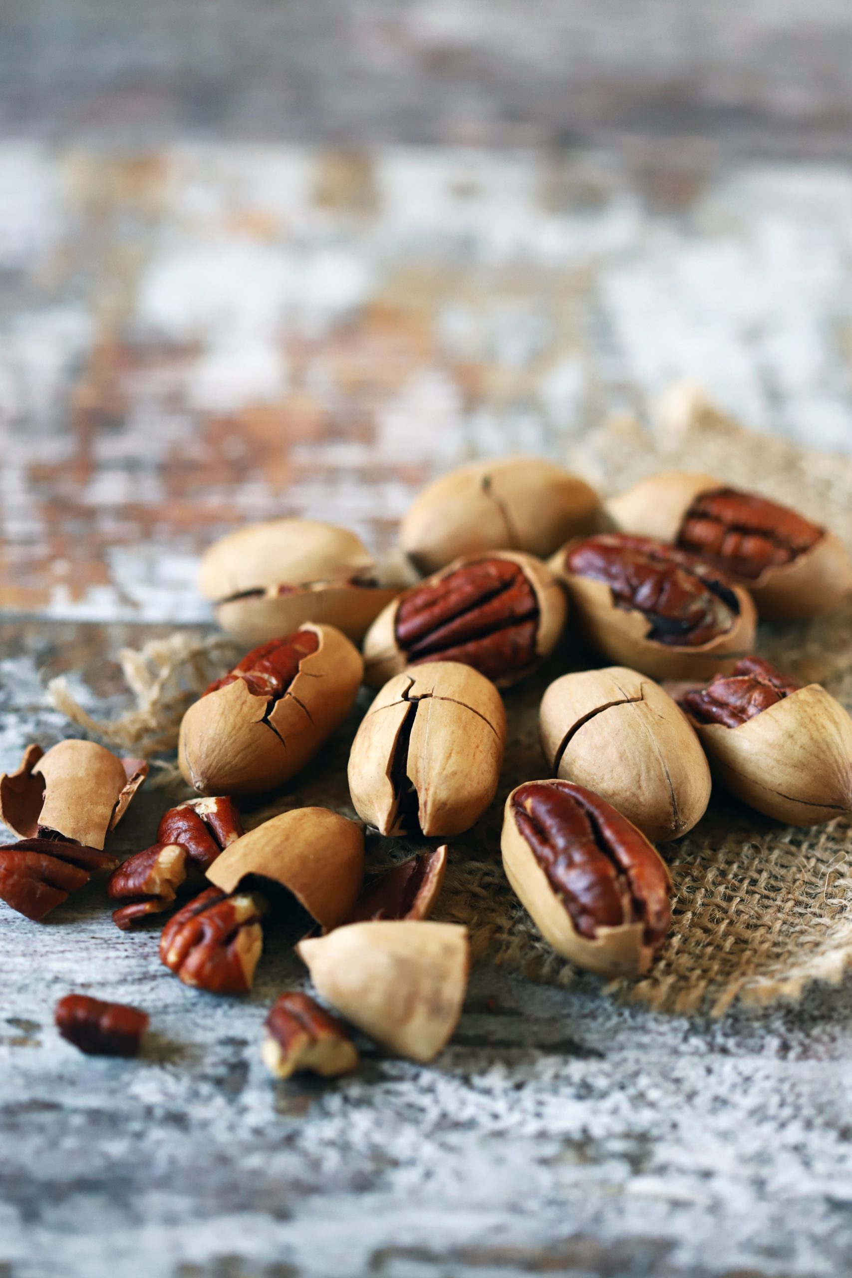 Nuts cracked and in shells on table.