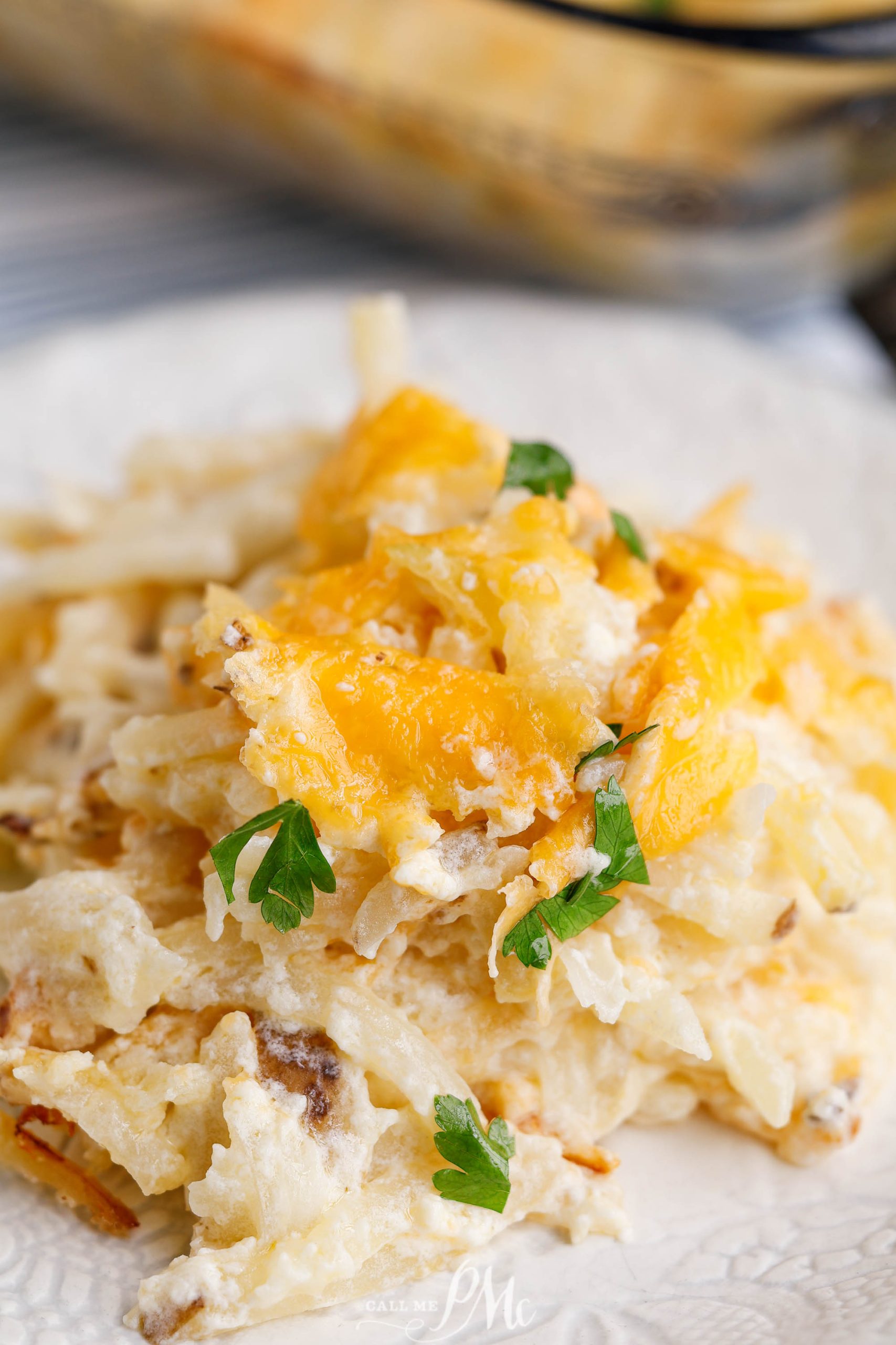 Cheesy hashbrowns on a plate.