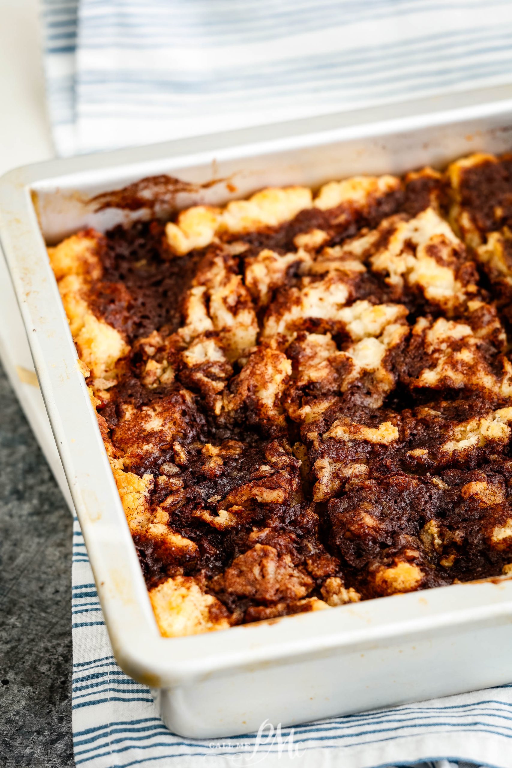 Butter Swim Cinnamon Biscuits in a white baking dish .