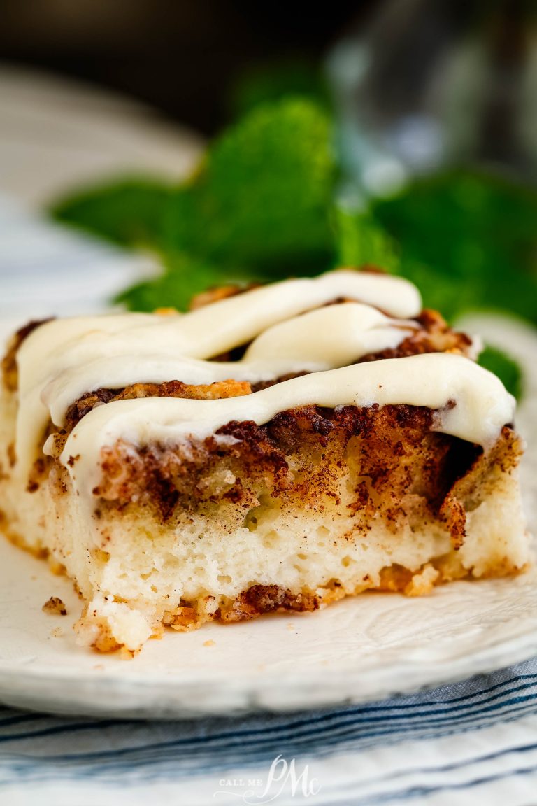 A piece of cinnamon roll cake on a plate.