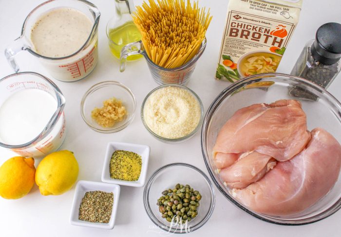 Chicken Caesar Angel Hair Pasta ingredients on a white table.