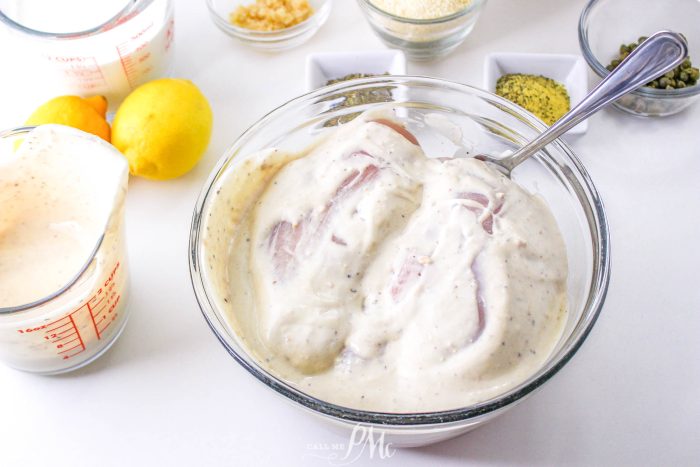 A bowl with ingredients and a measuring spoon.