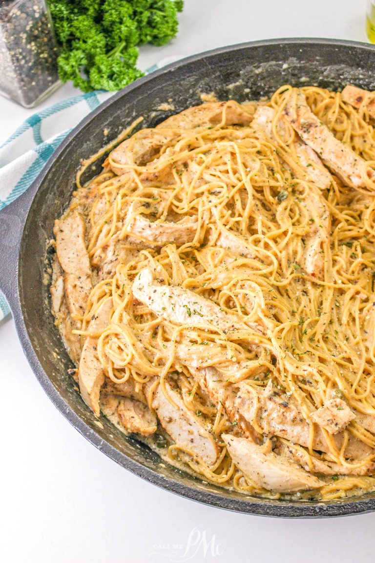 A skillet filled with chicken and pasta.