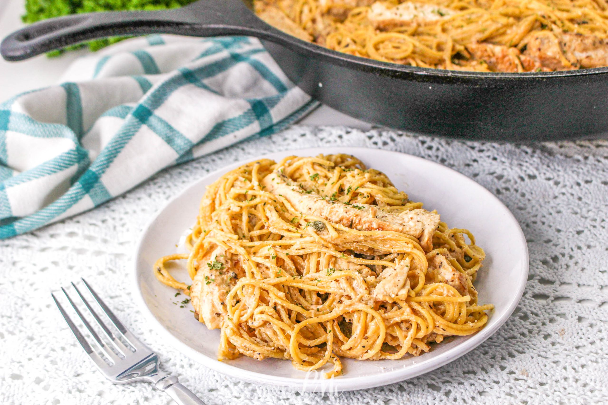 Chicken Caesar Angel Hair Pasta  A plate of spaghetti with chicken in a skillet.