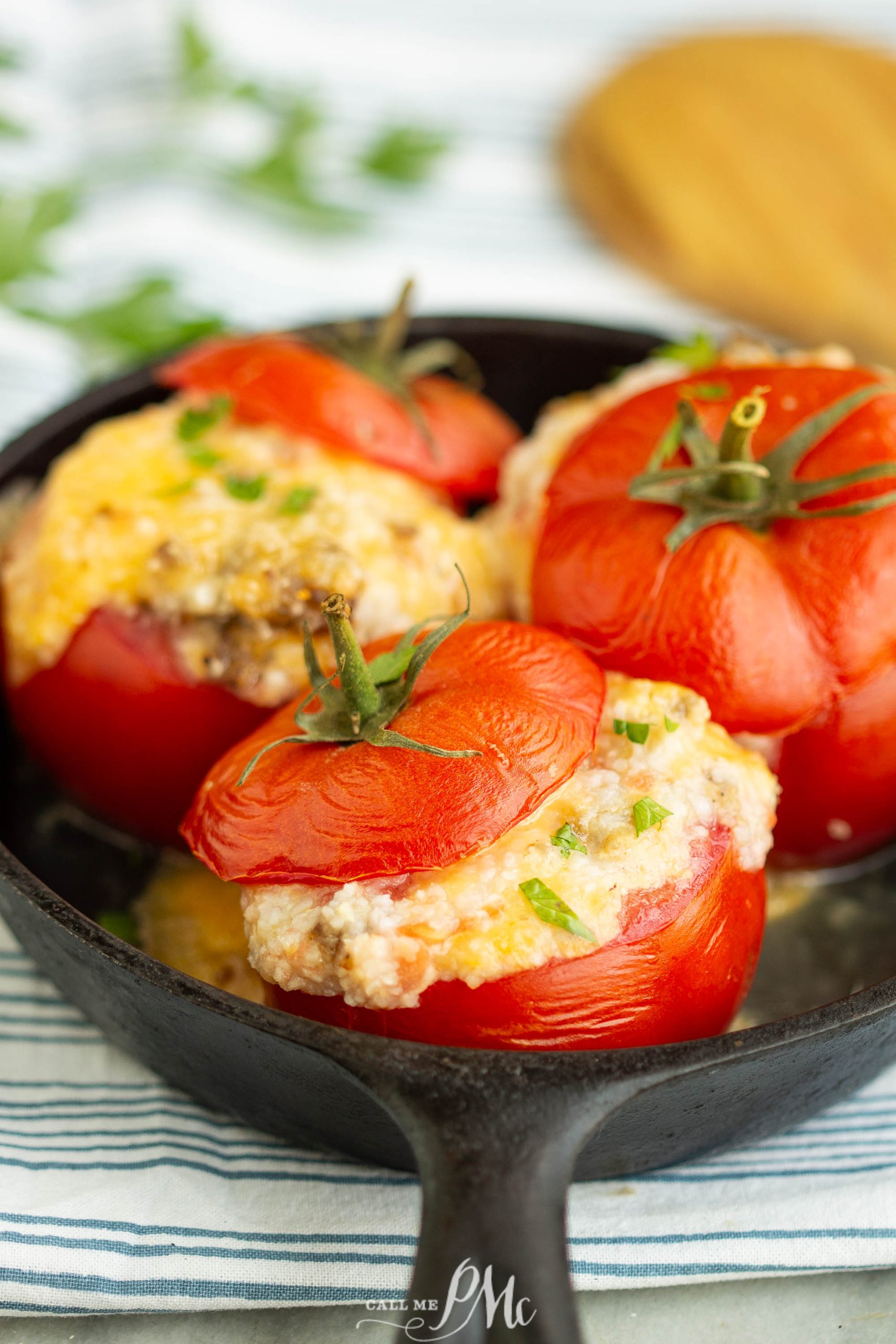 Grits Casserole Stuffed Baked Tomatoes in a skillet with cheese on top.