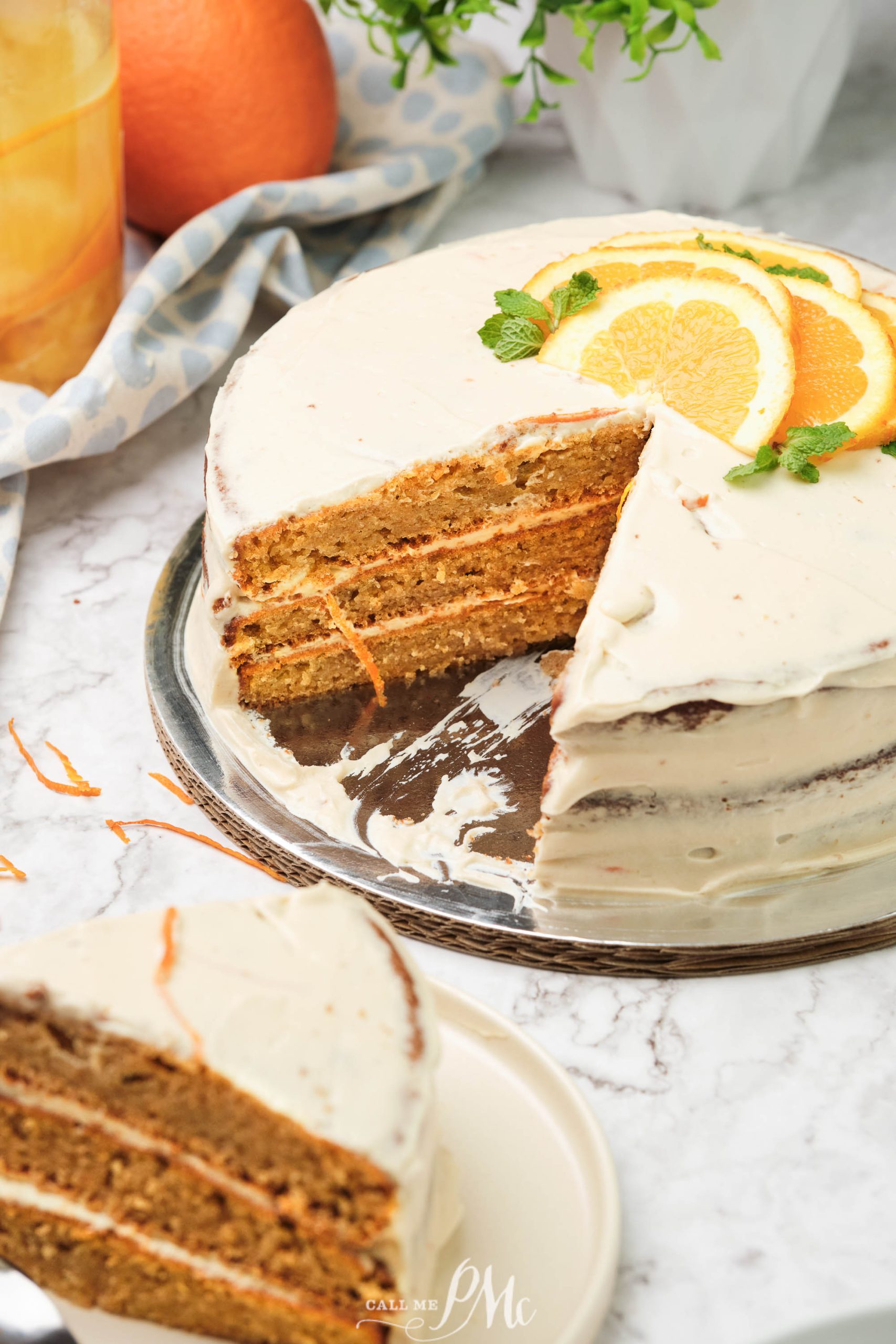 A carrot cake with a slice taken out of it.