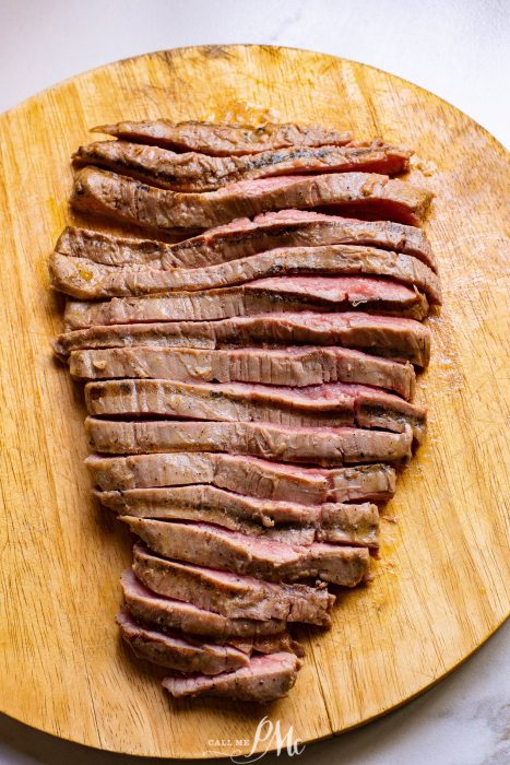 Ribeye with Feta Gravy, a piece of steak on a wooden cutting board.