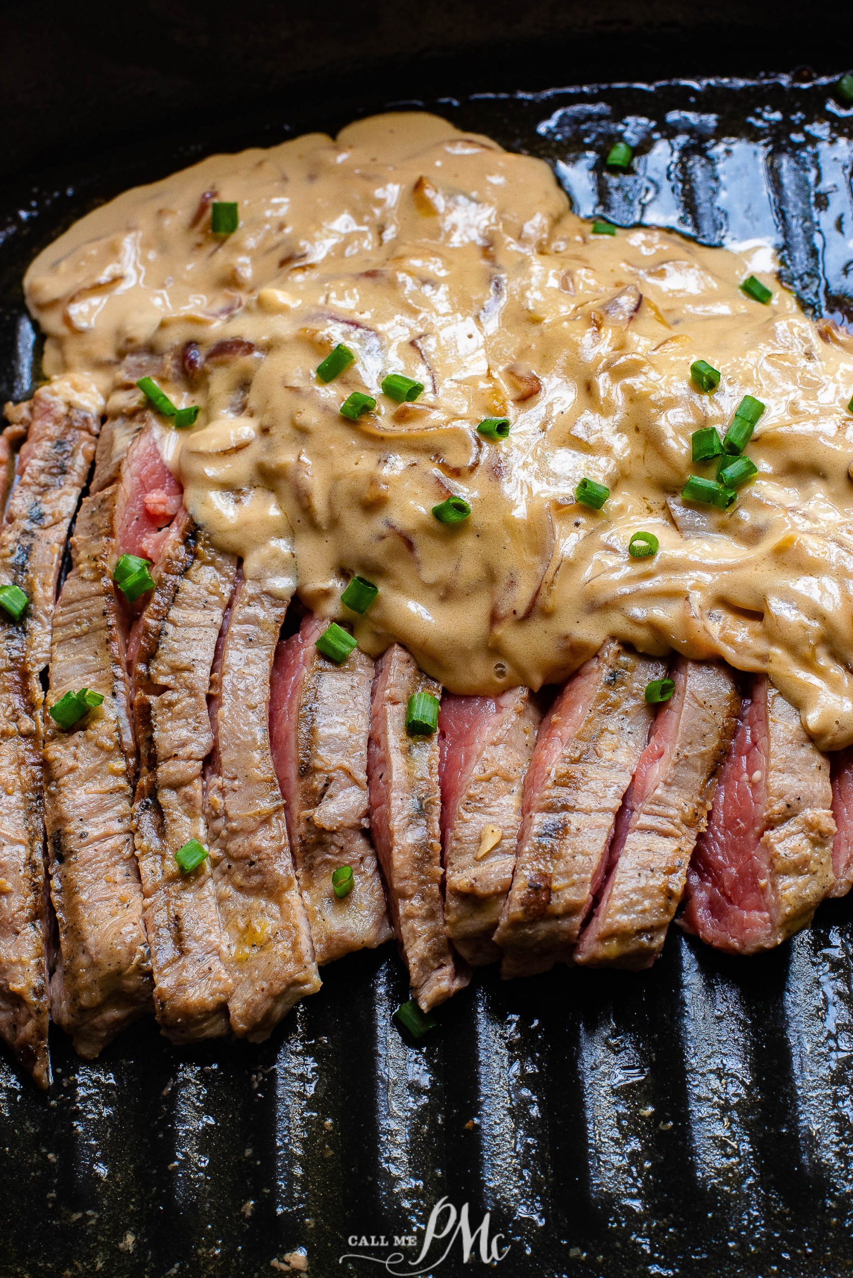 Ribeye with Feta Gravy, a steak on a grill with a sauce on it.