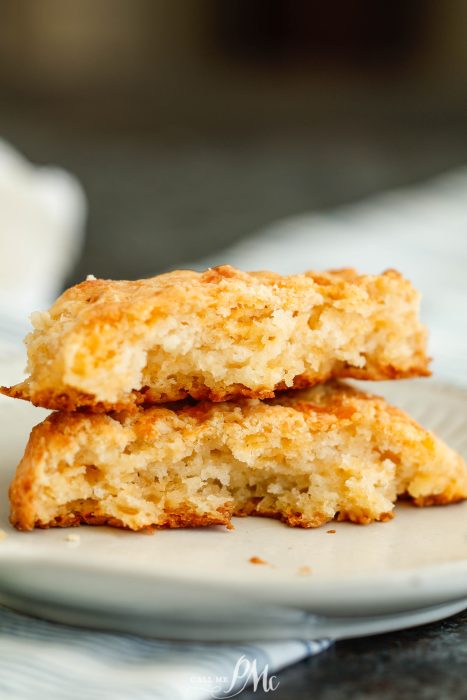 Two pieces of biscuits on a plate.