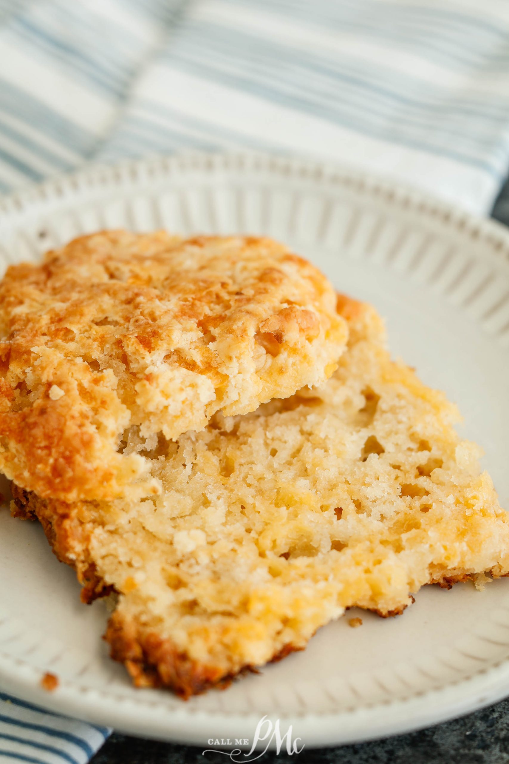 Small Batch Cheddar Biscuits, a plate with a biscuit on it.