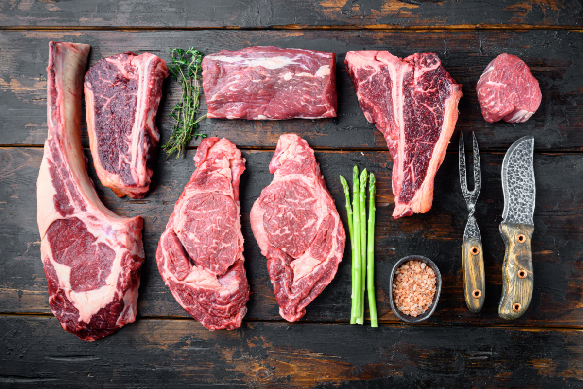 different beef cuts on a chopping block