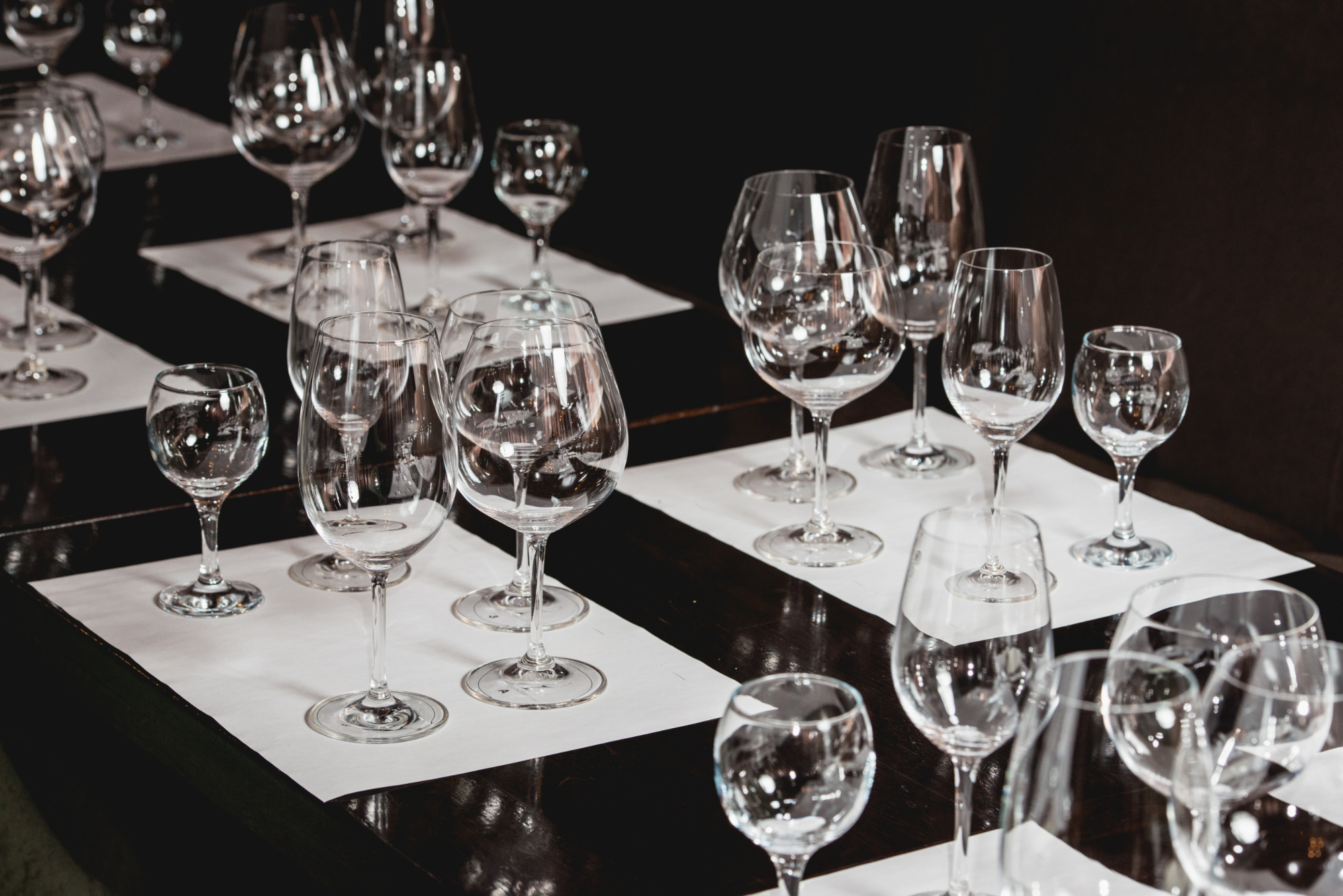 A group of wine glasses on a table.