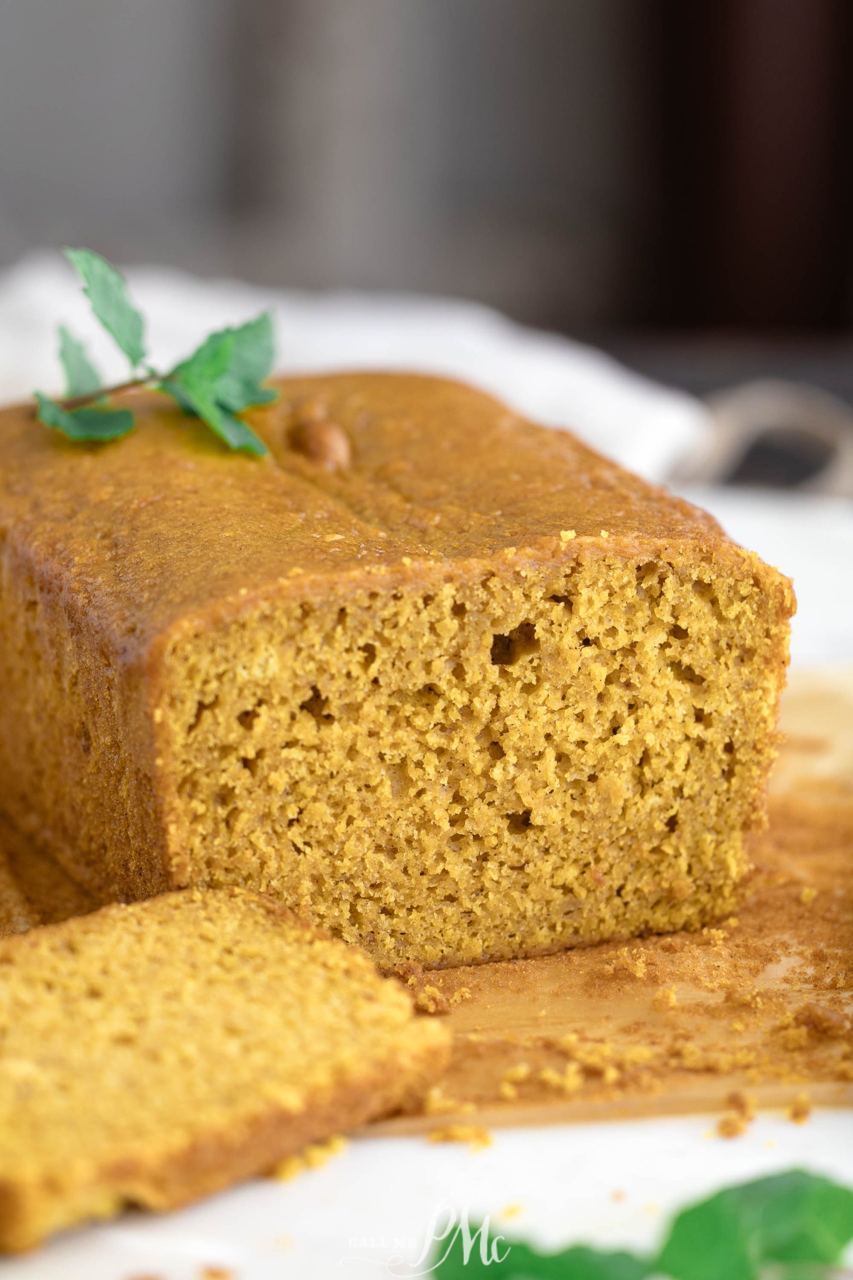 A slice of pumpkin bread on a plate.