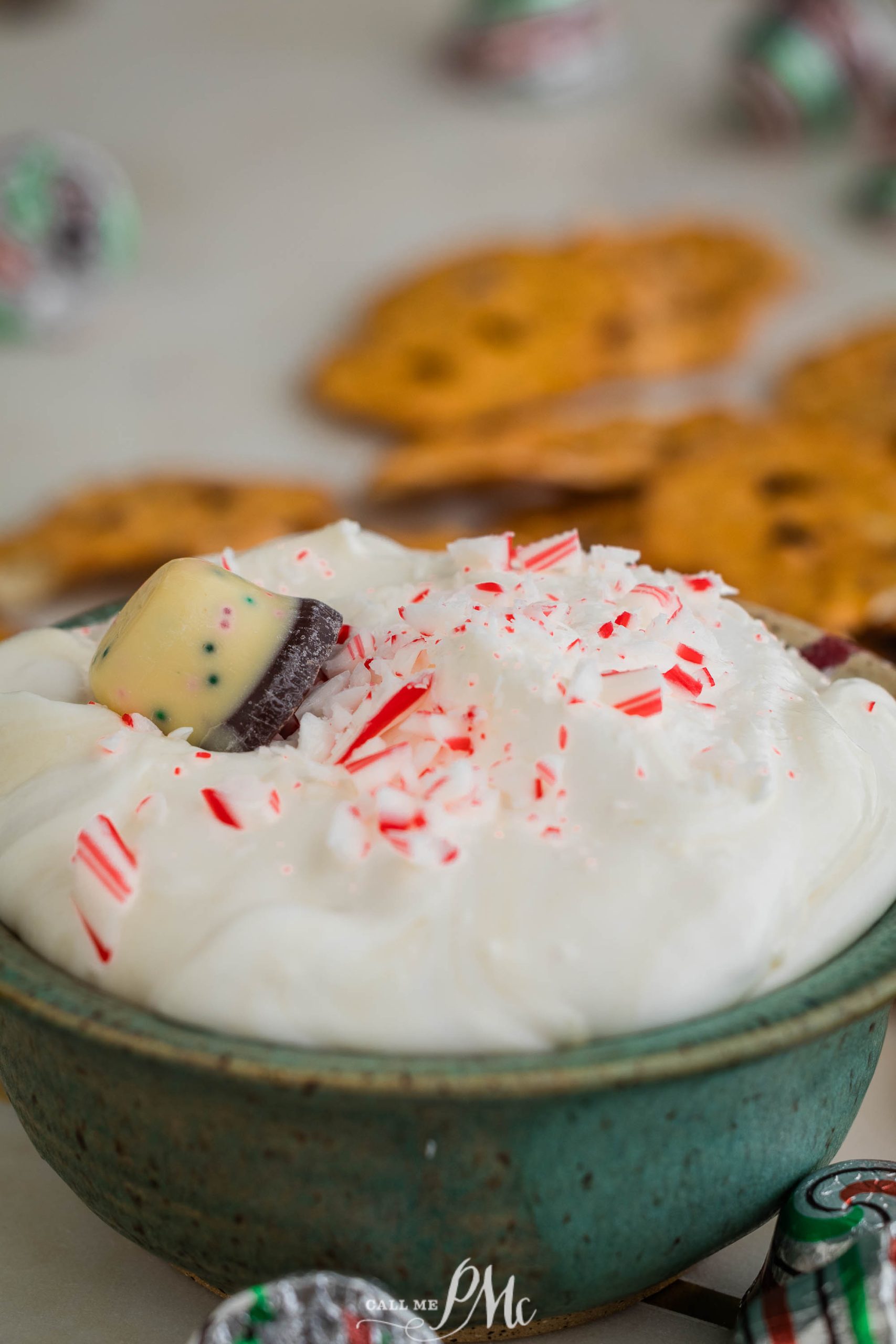 A bowl with whipped cream and candy canes.