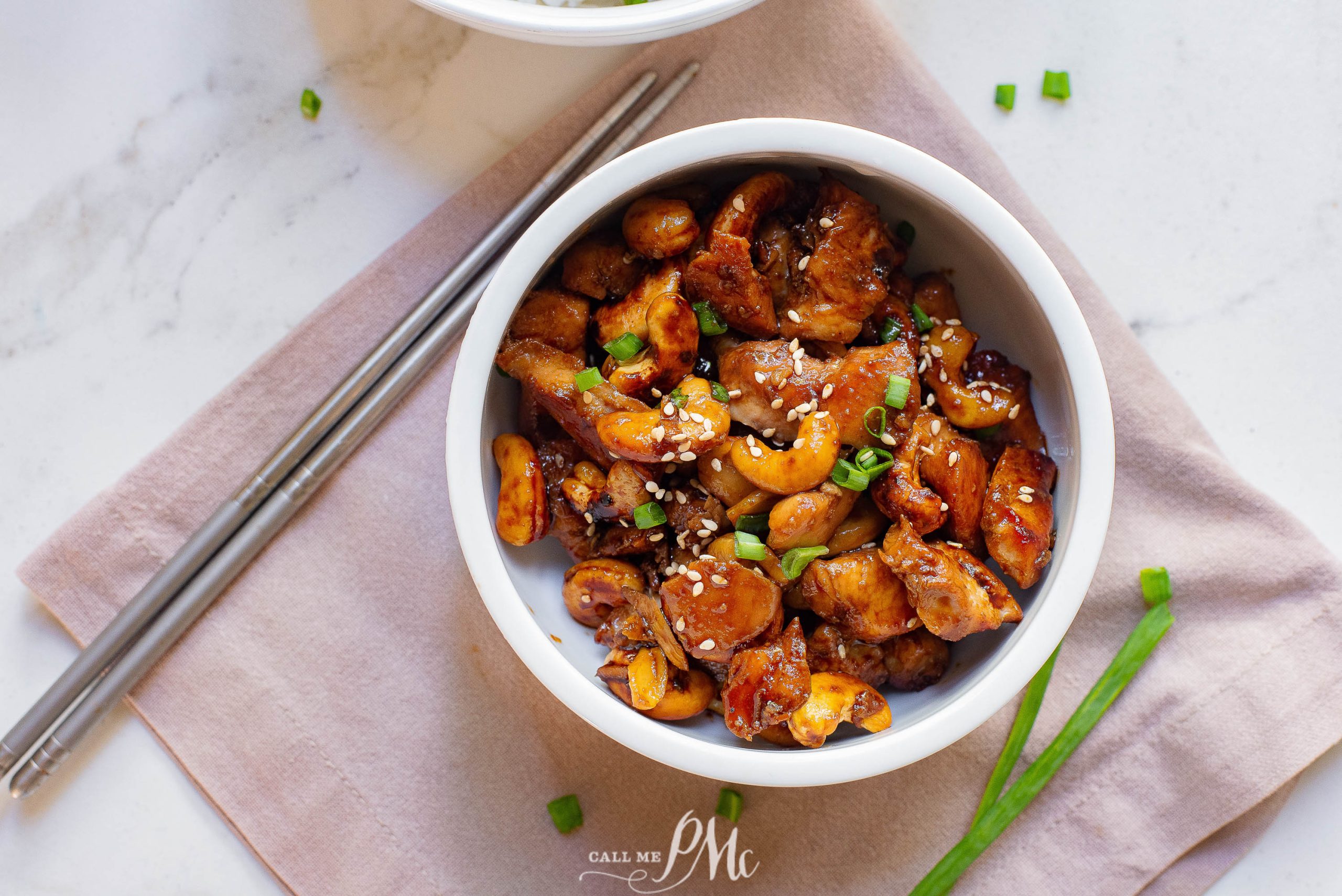 Sheet Pan Honey Soy Cashew Chicken with sesame seeds and chopsticks.