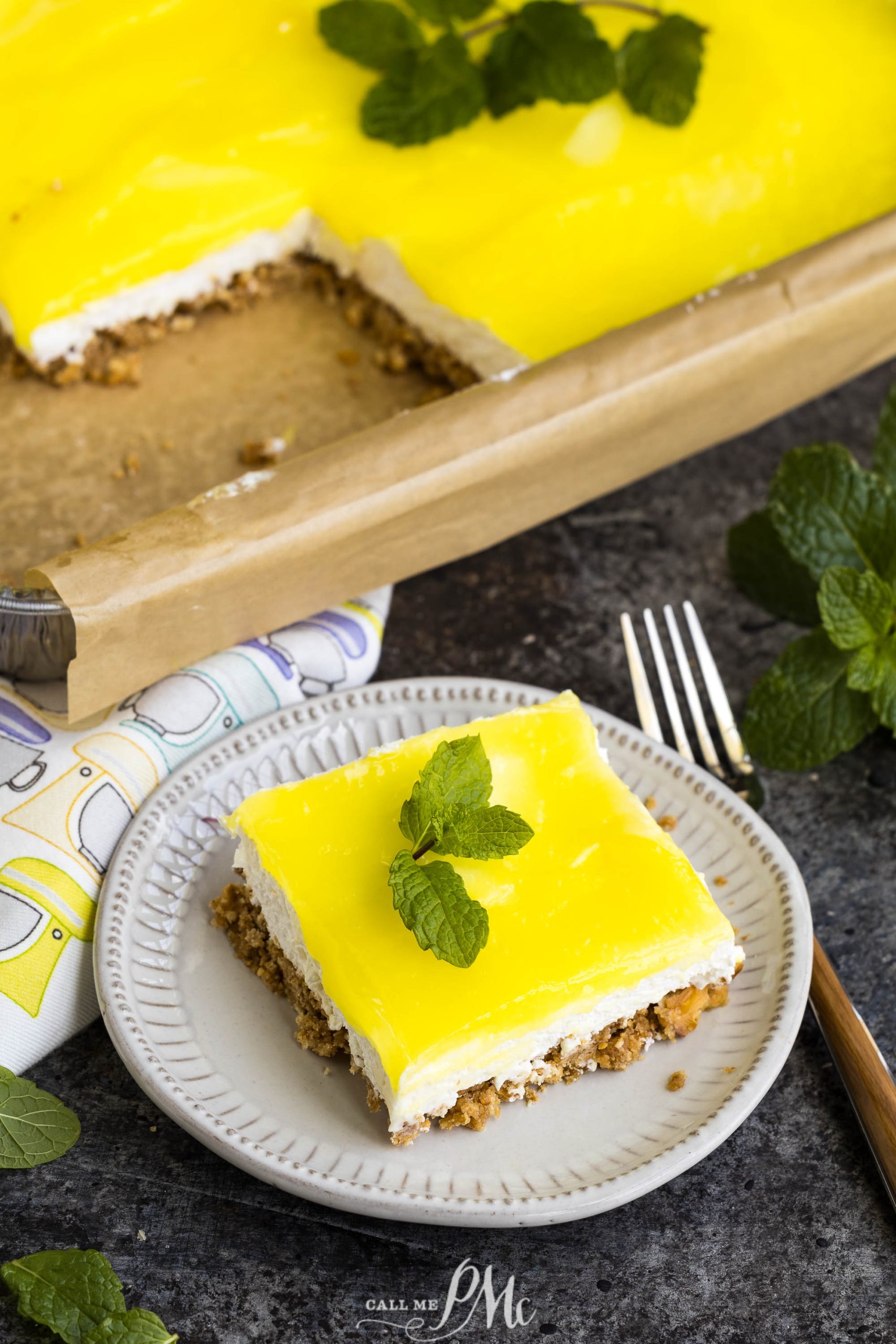 A slice of Lemon Pretzel Lush on a plate.