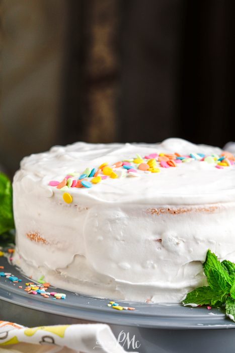 A Peach Jello Layer Cake with sprinkles on top.