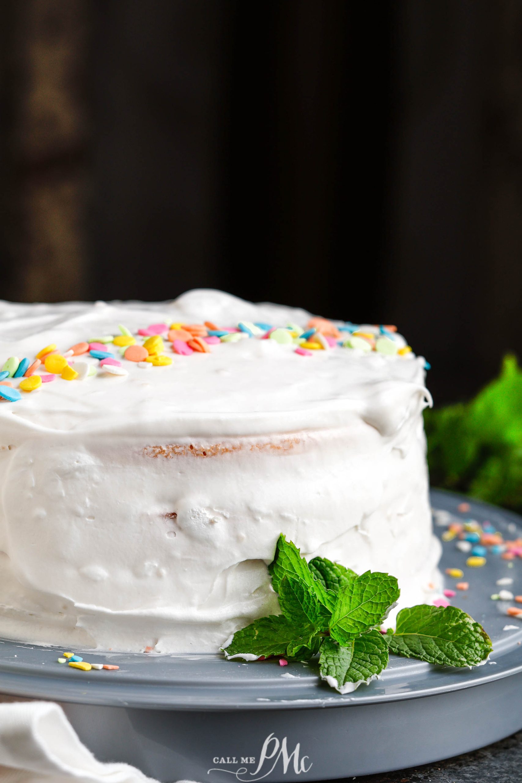 A Peach Jello Layer Cake with sprinkles on top.