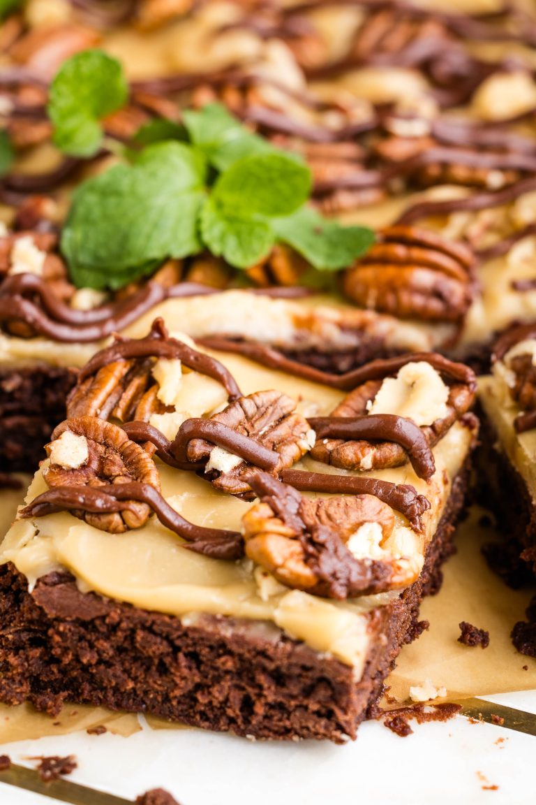 A praline brownie with caramel and pecans on top.