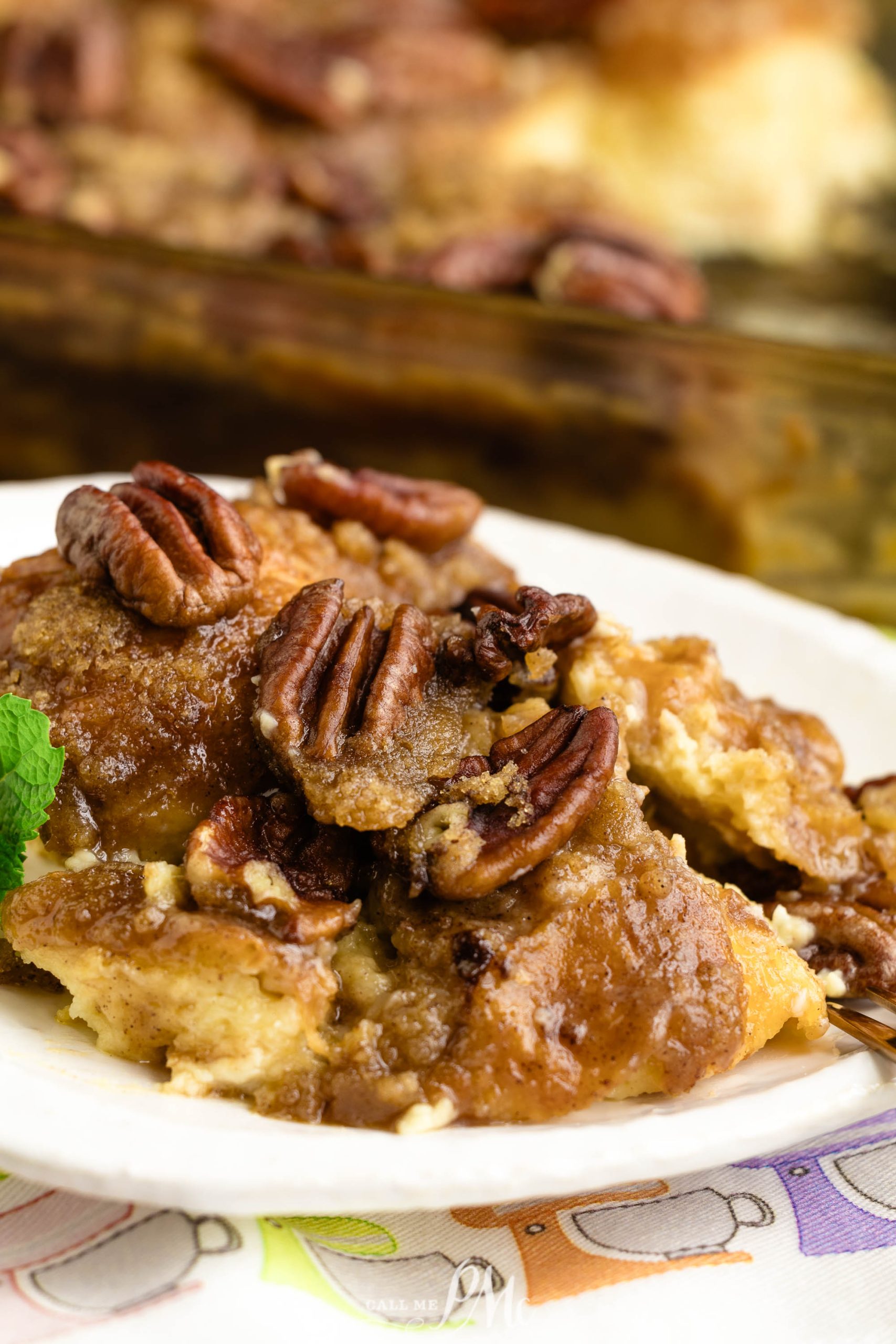 French toast casserole with pecans on a plate.