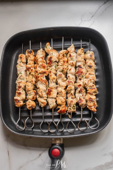 🎉Stovetop Chicken Souvlaki on skewers in a pan.