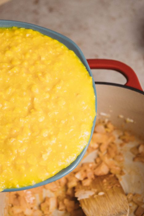 A pot with a yellow liquid in it.