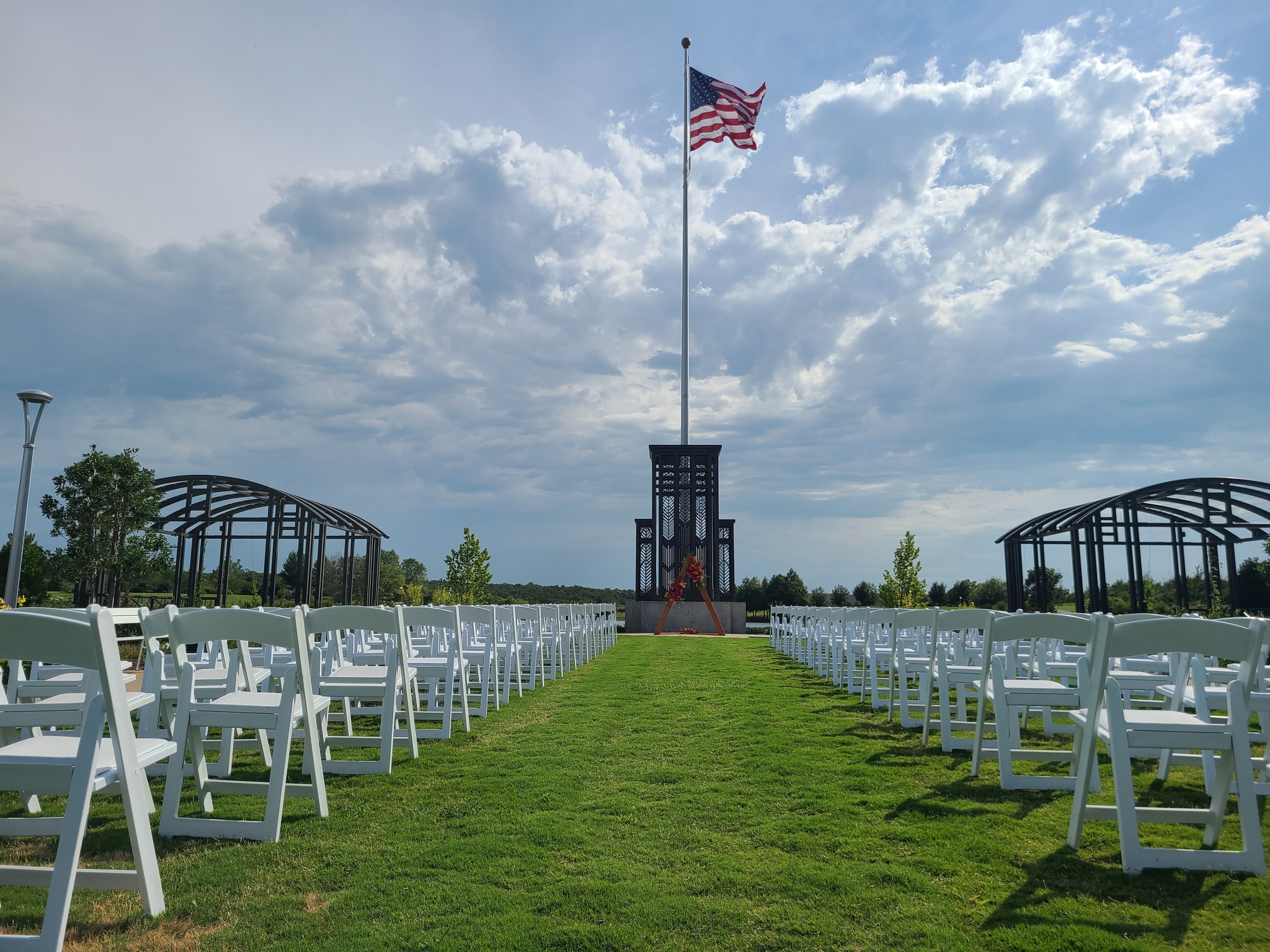 A group of white chairs in a grassy area, things to do in Tulsa.