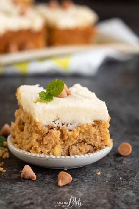 A white plate with a piece of cake on it.