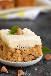 A white plate with a piece of cake on it.