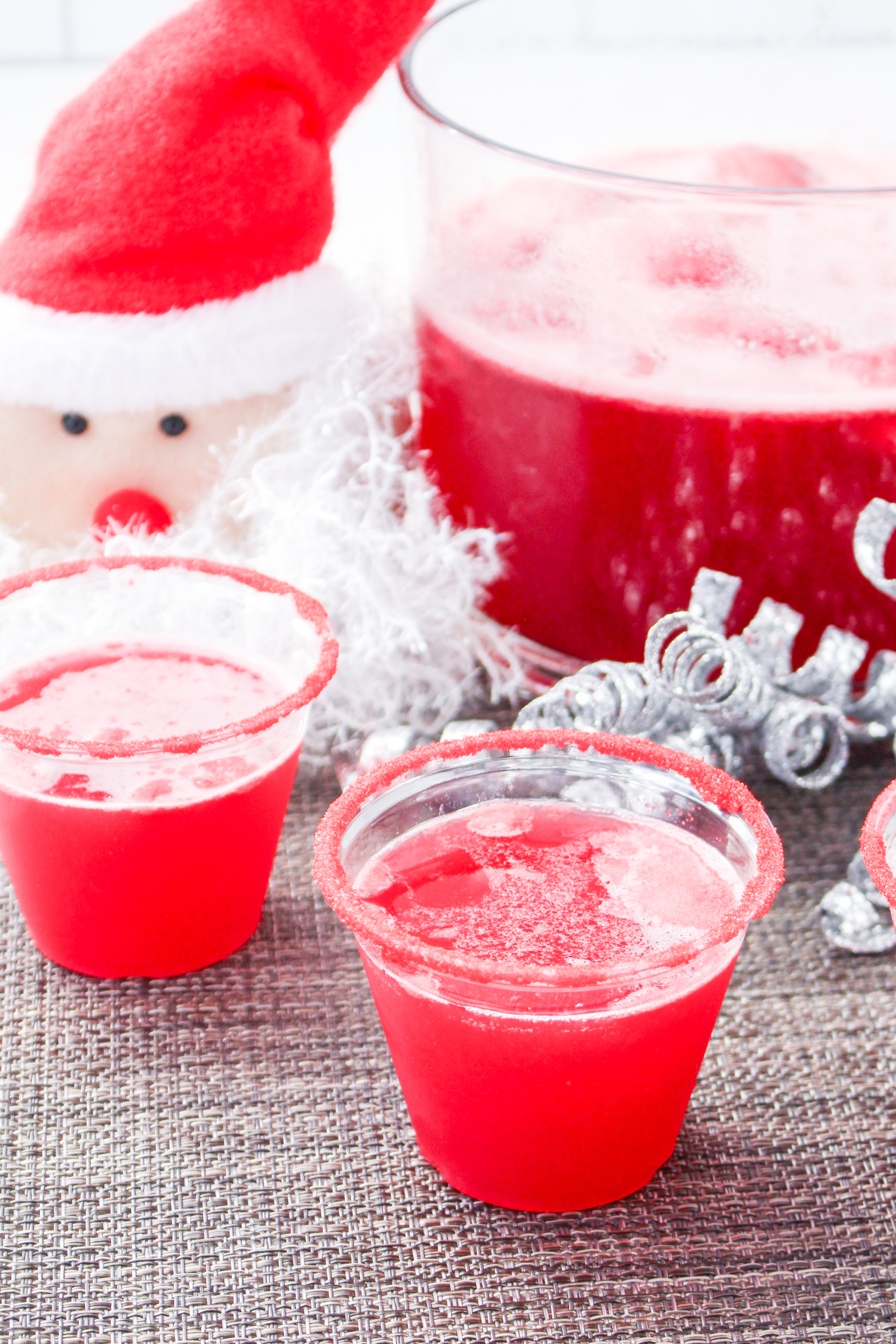 A group of red cups with a santa hat on them.