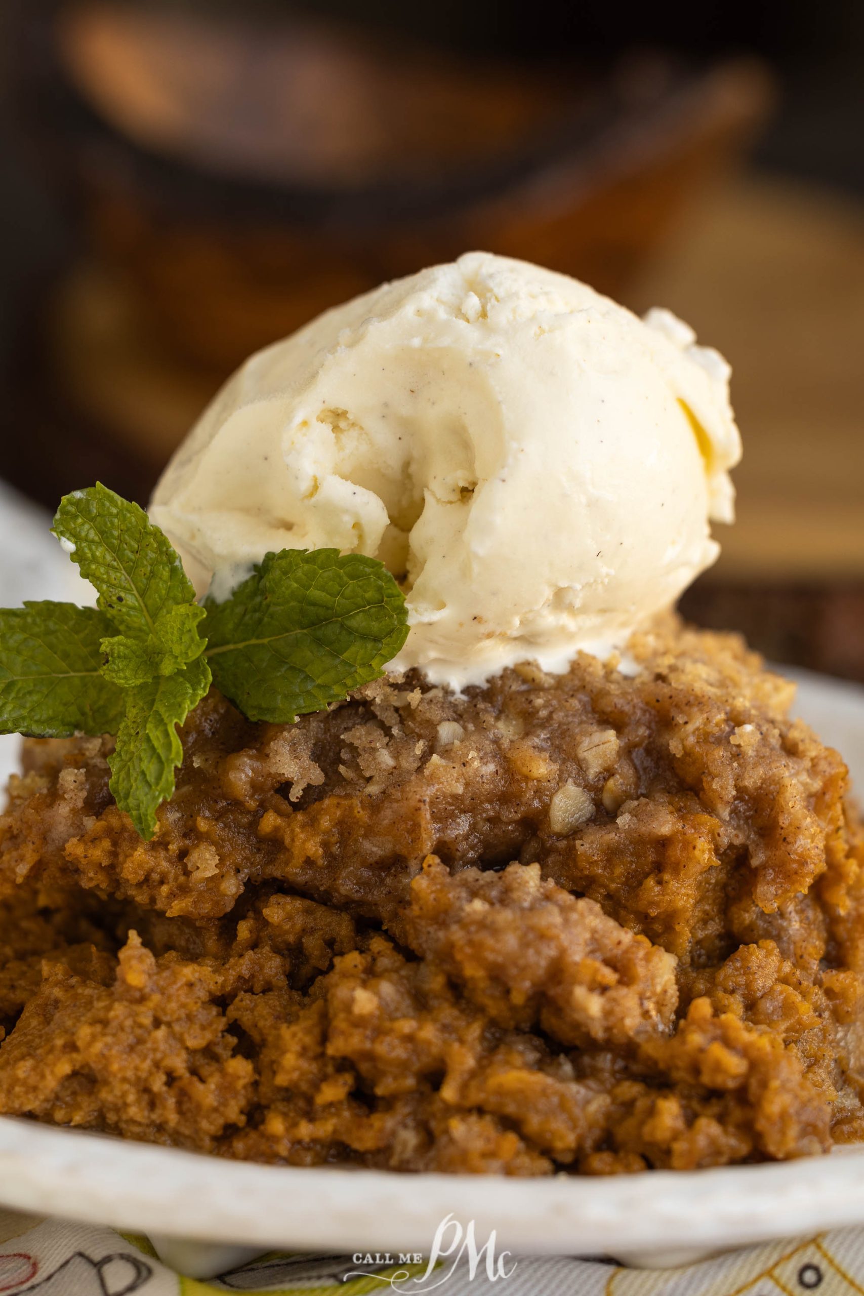 Crustless Pumpkin Pie Crumble with ice cream on a plate.