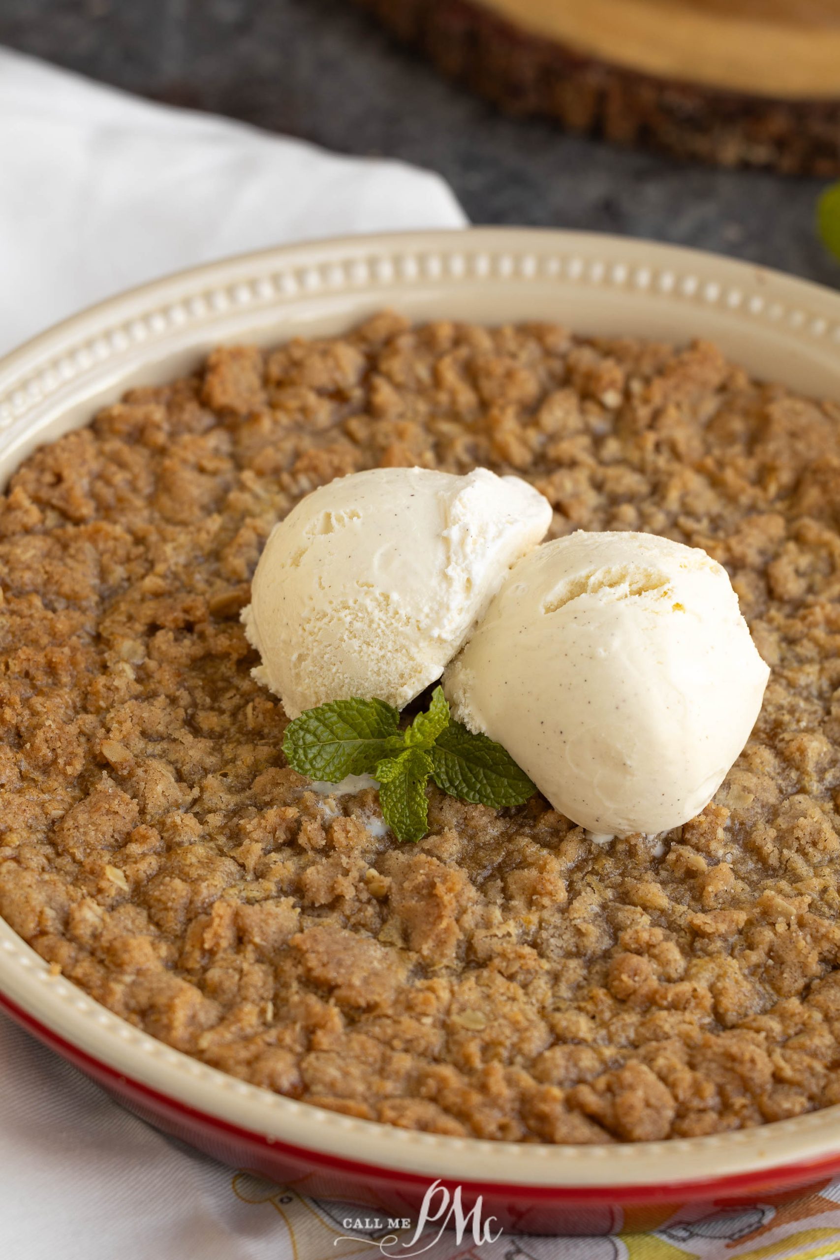 Crustless Pumpkin Pie Crumble with a scoop of ice cream on top.