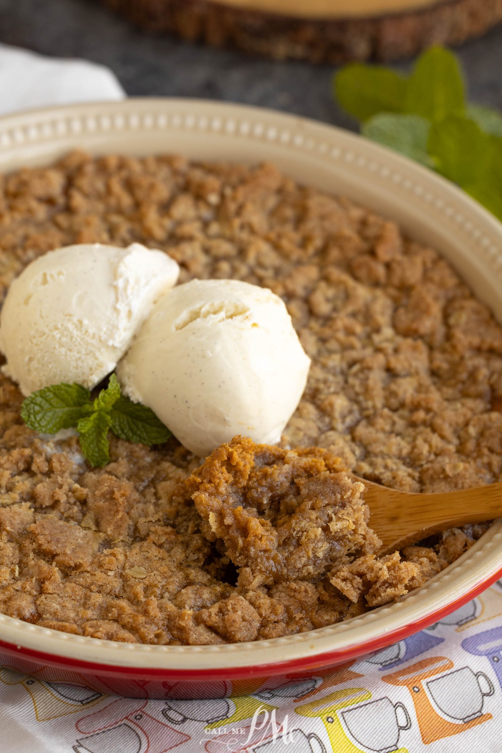 A pie with ice cream and a scoop of ice cream.