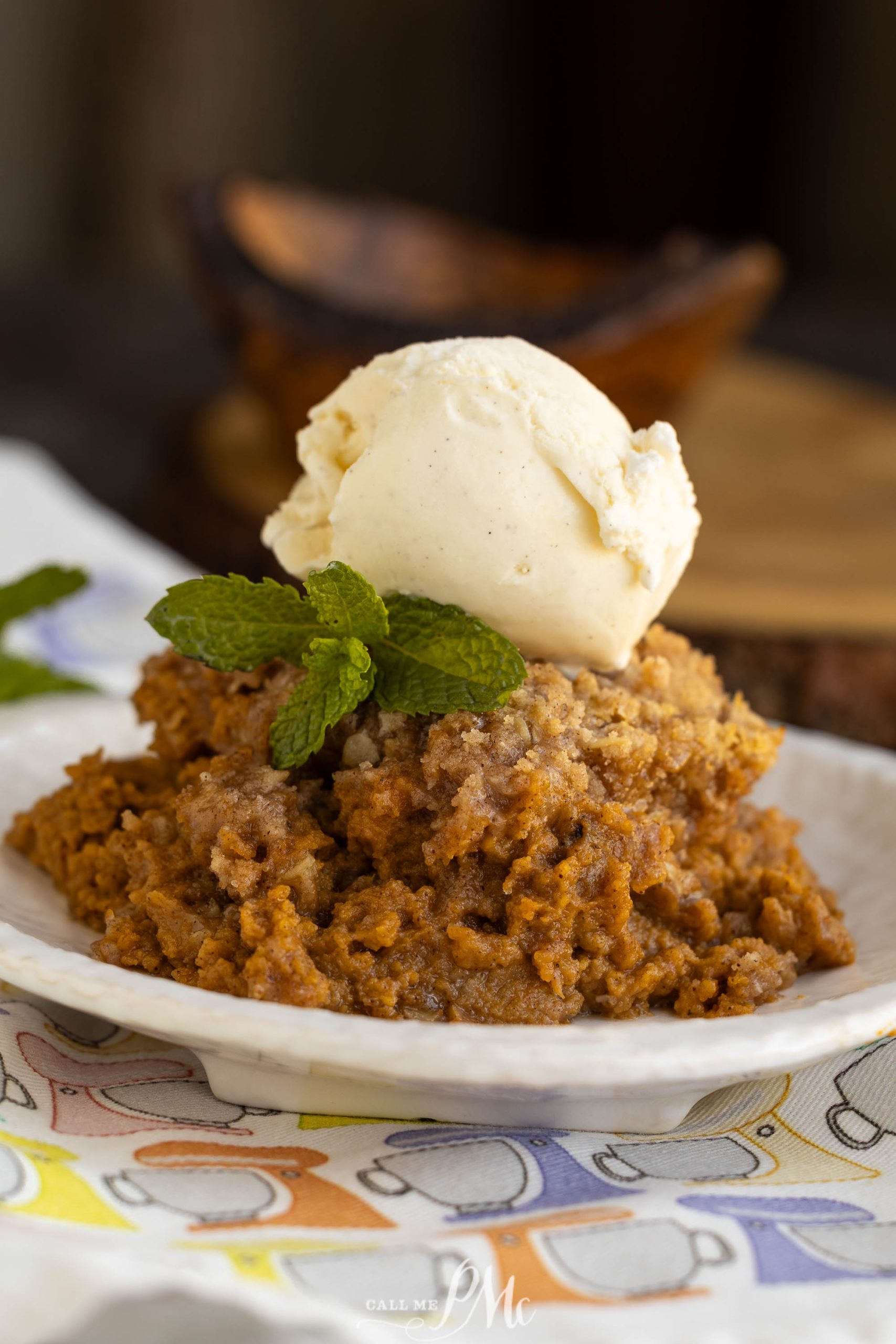 A plate with a scoop of ice cream on top.