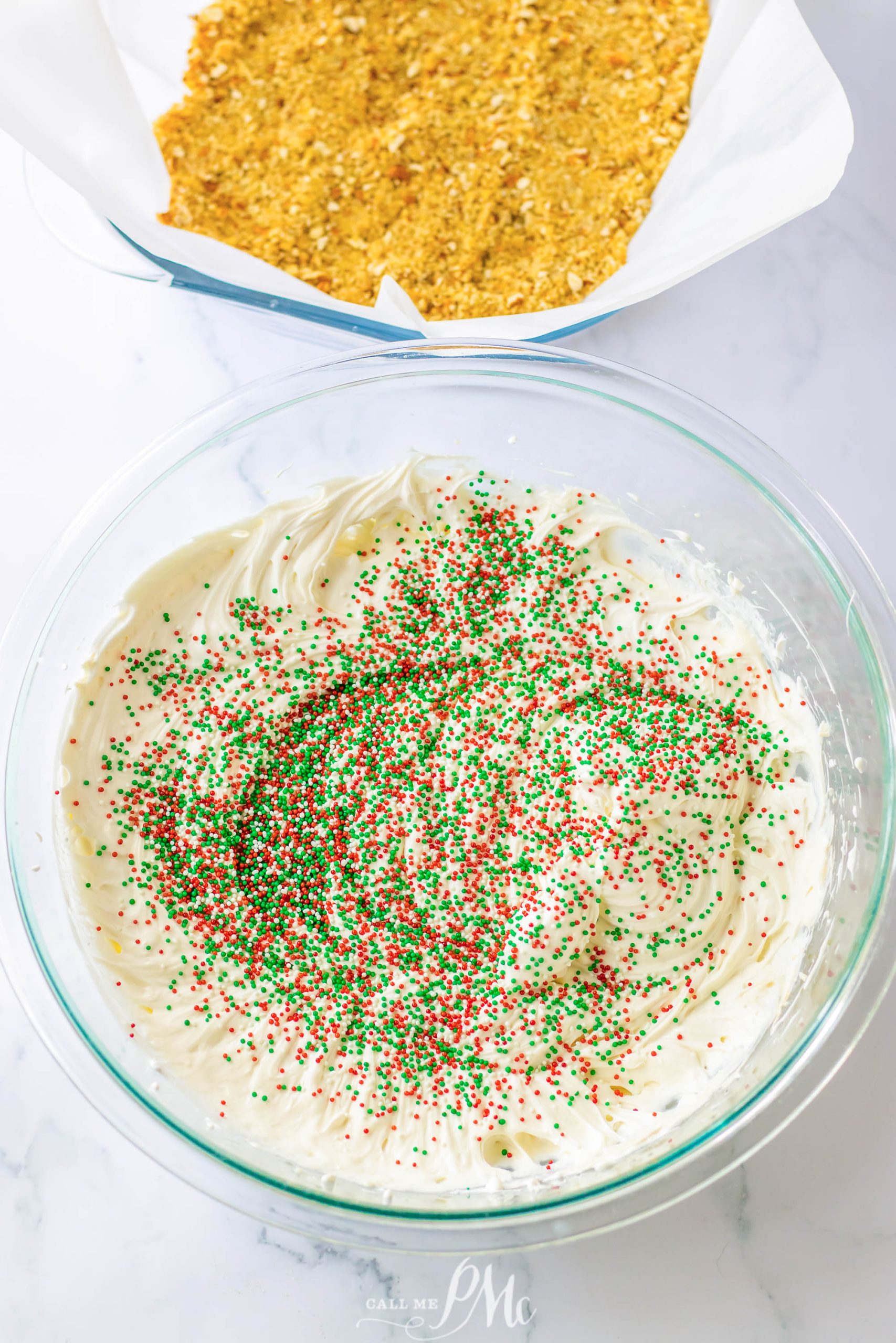 A bowl filled with whipped cream and sprinkles.