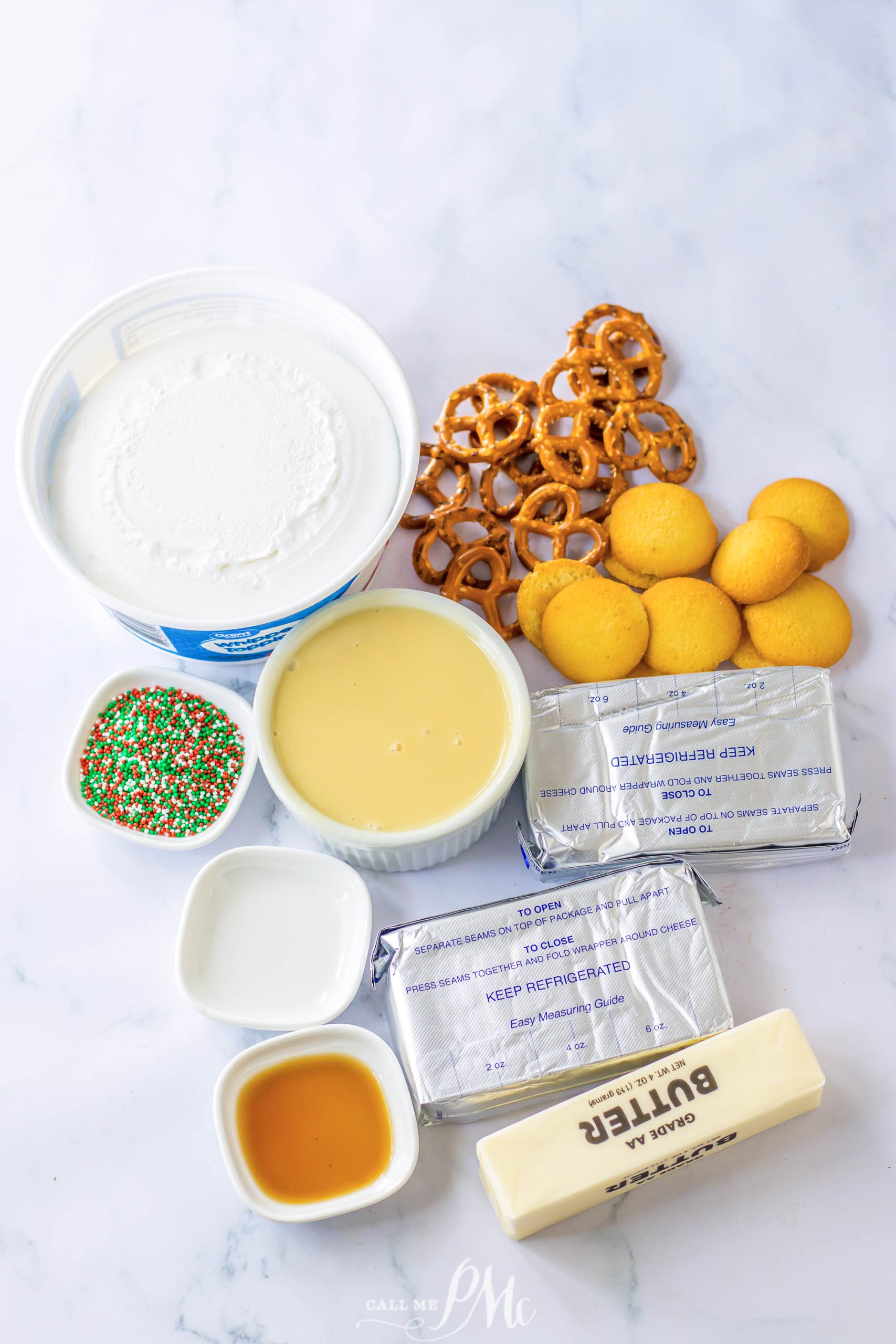 The ingredients for Funfetti Crunch Cake are laid out on a marble table.