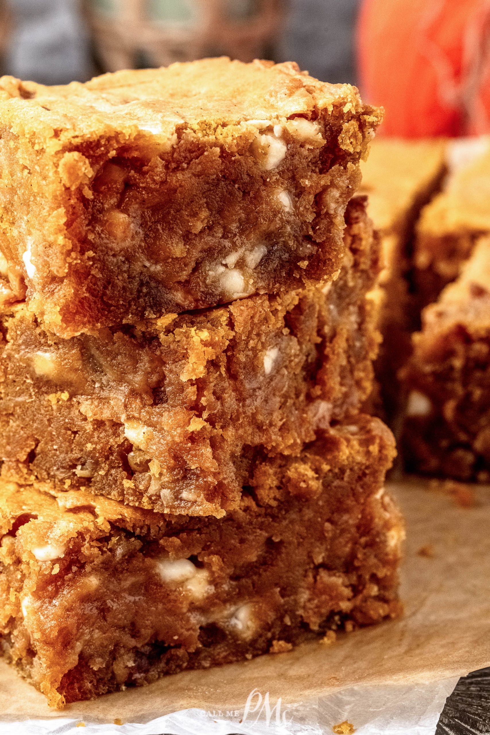 A stack of pumpkin blondies stacked on top of each other.