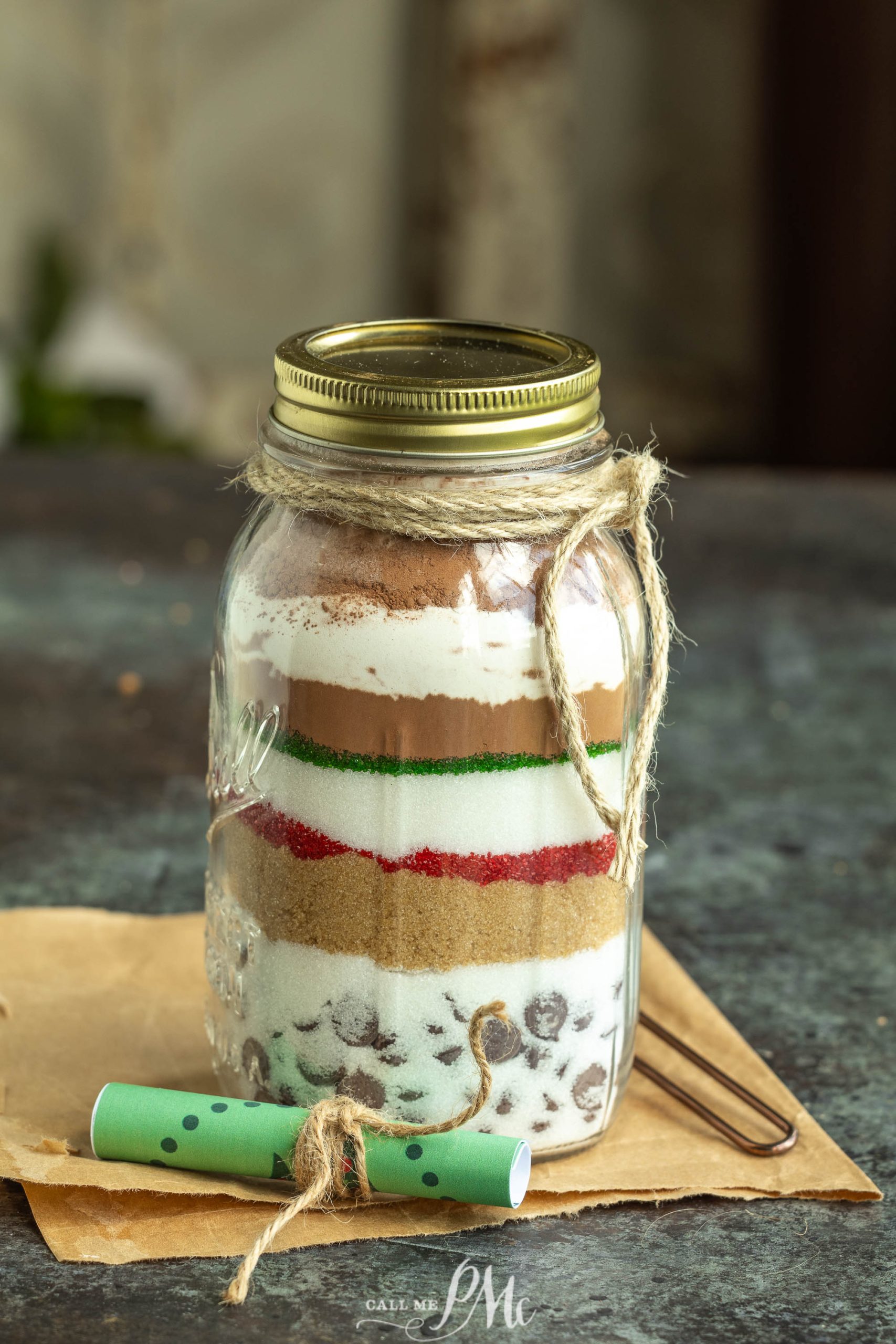 A mason jar filled with a mixture of cookies and ice cream.