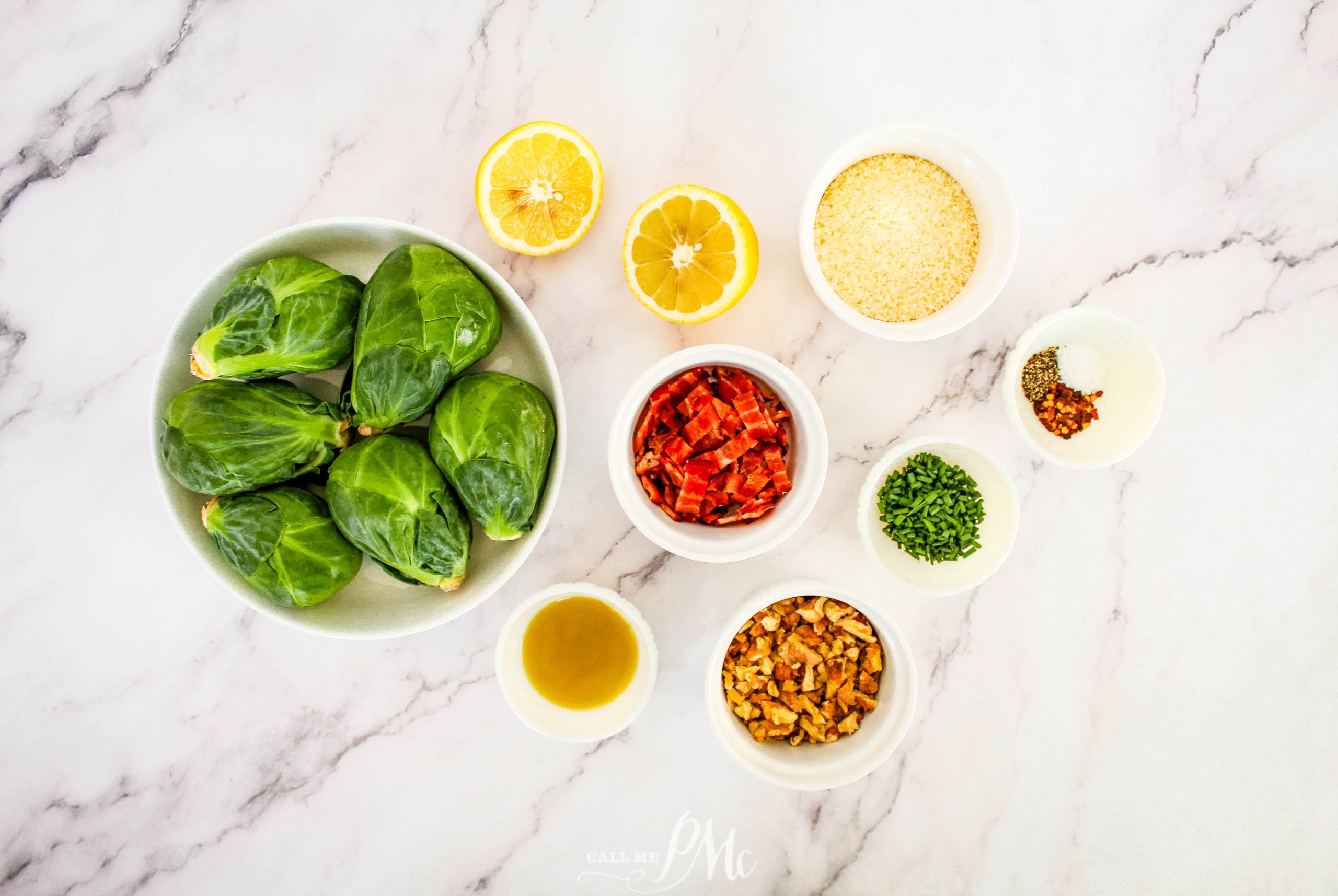 Ingredients for brussels sprouts on a marble countertop.