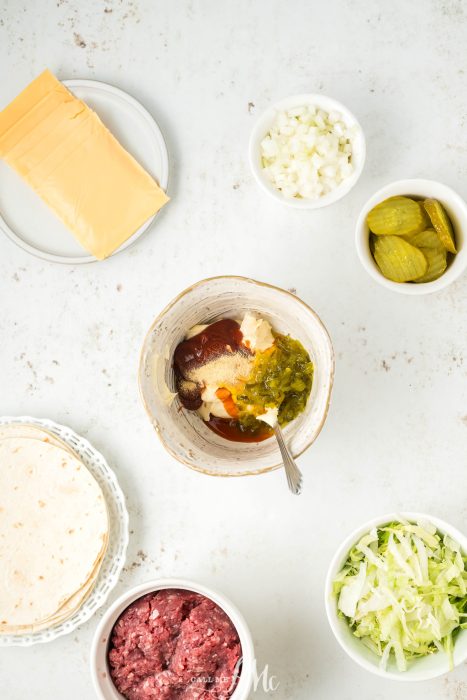 The ingredients for texas tacos are laid out on a white table.