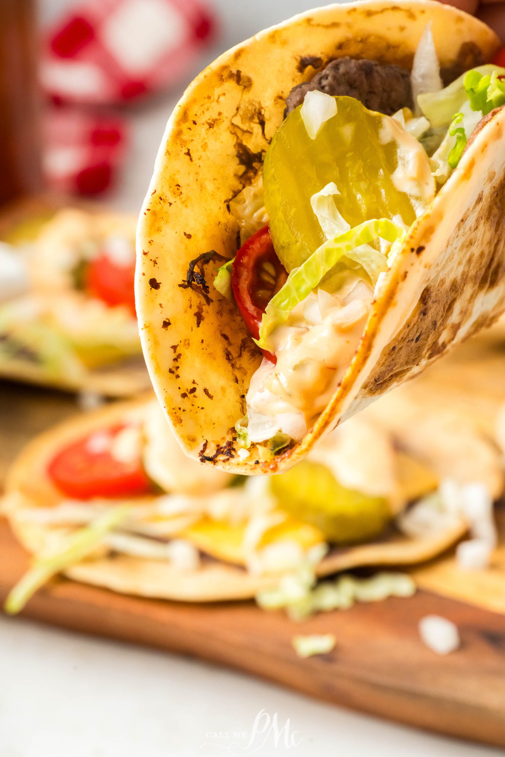 Viral Smash Burger Tacos on a wooden cutting board.