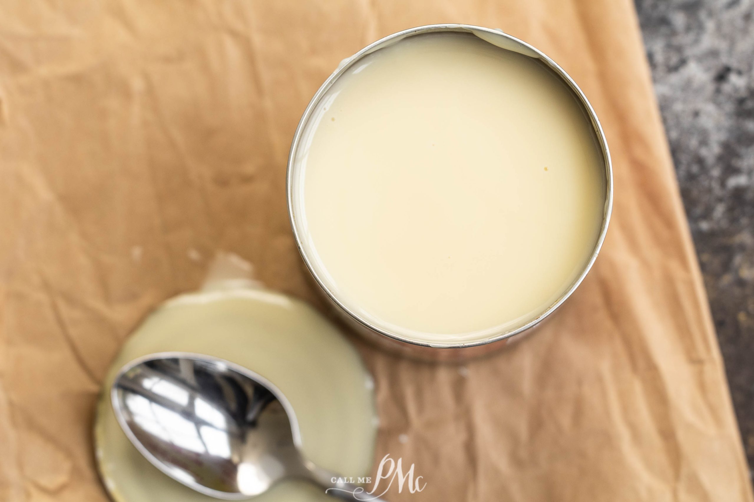 Substitute for Sweetened Condensed Milk, A can of cream with a spoon next to it.