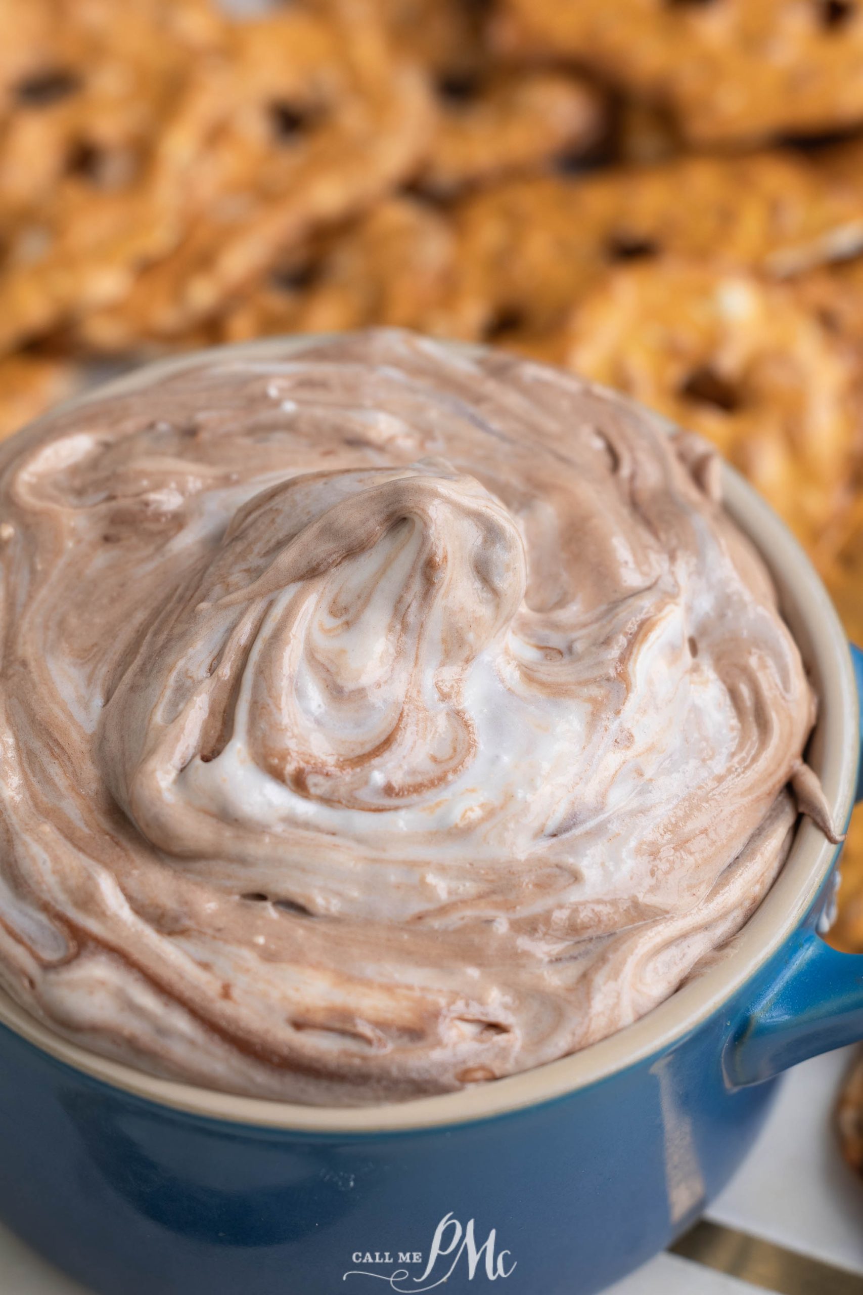 Pretzel dip in a blue bowl.