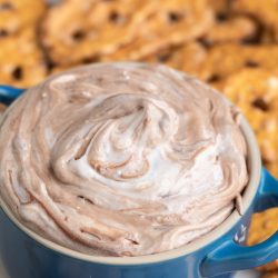 Chocolate pretzel dip in a blue bowl.