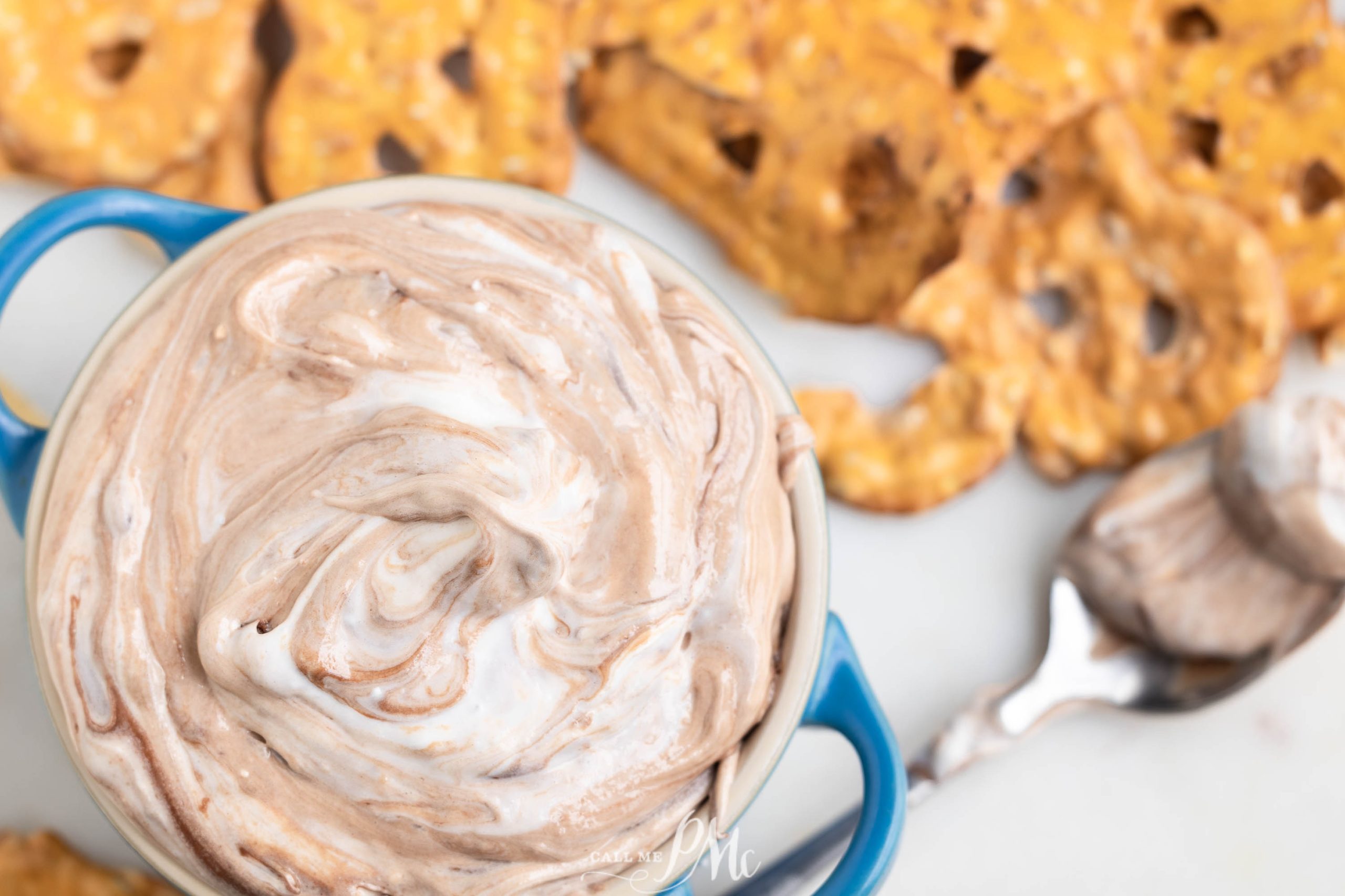 Chocolate pretzel dip in a blue bowl.