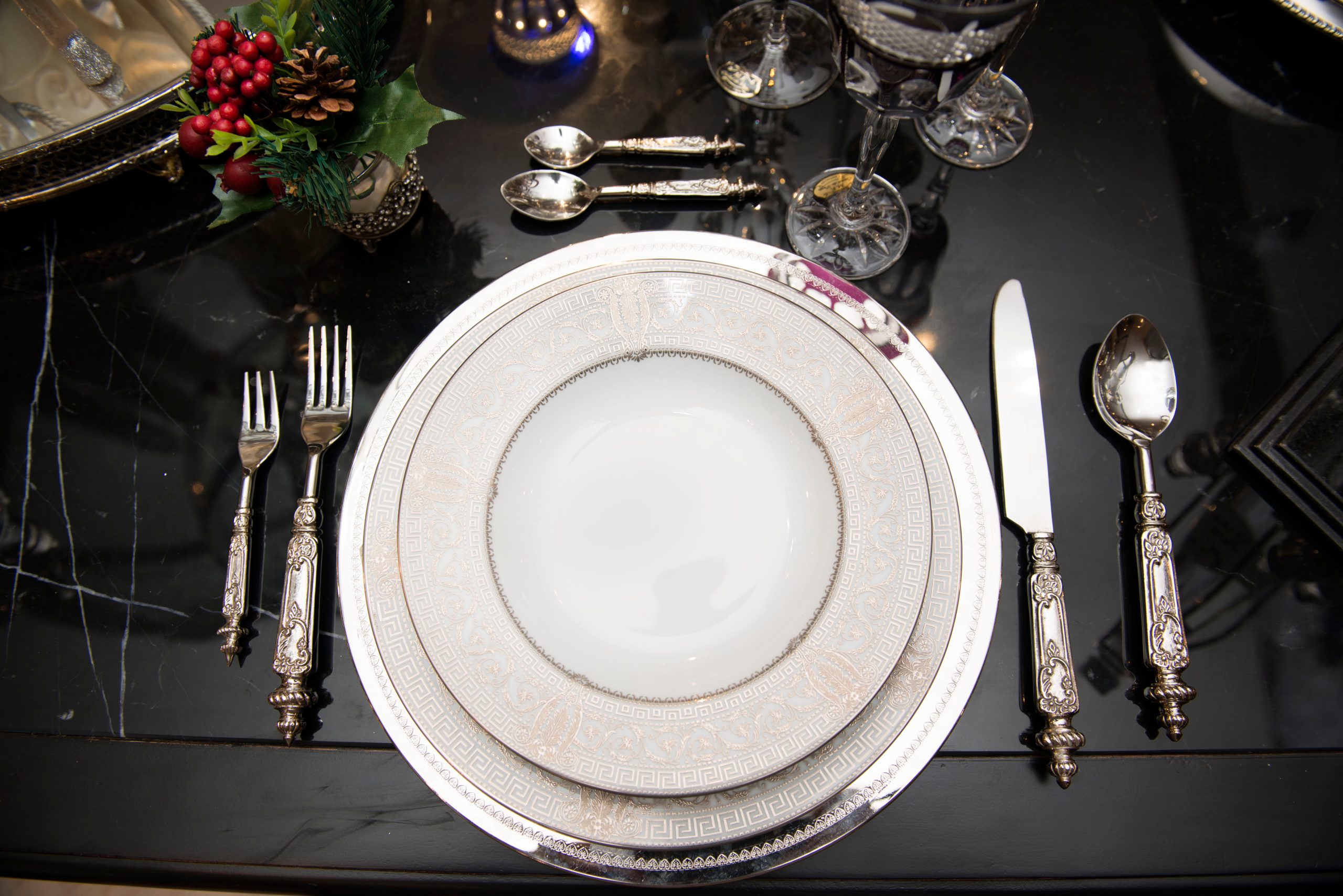 A place setting on a black table.